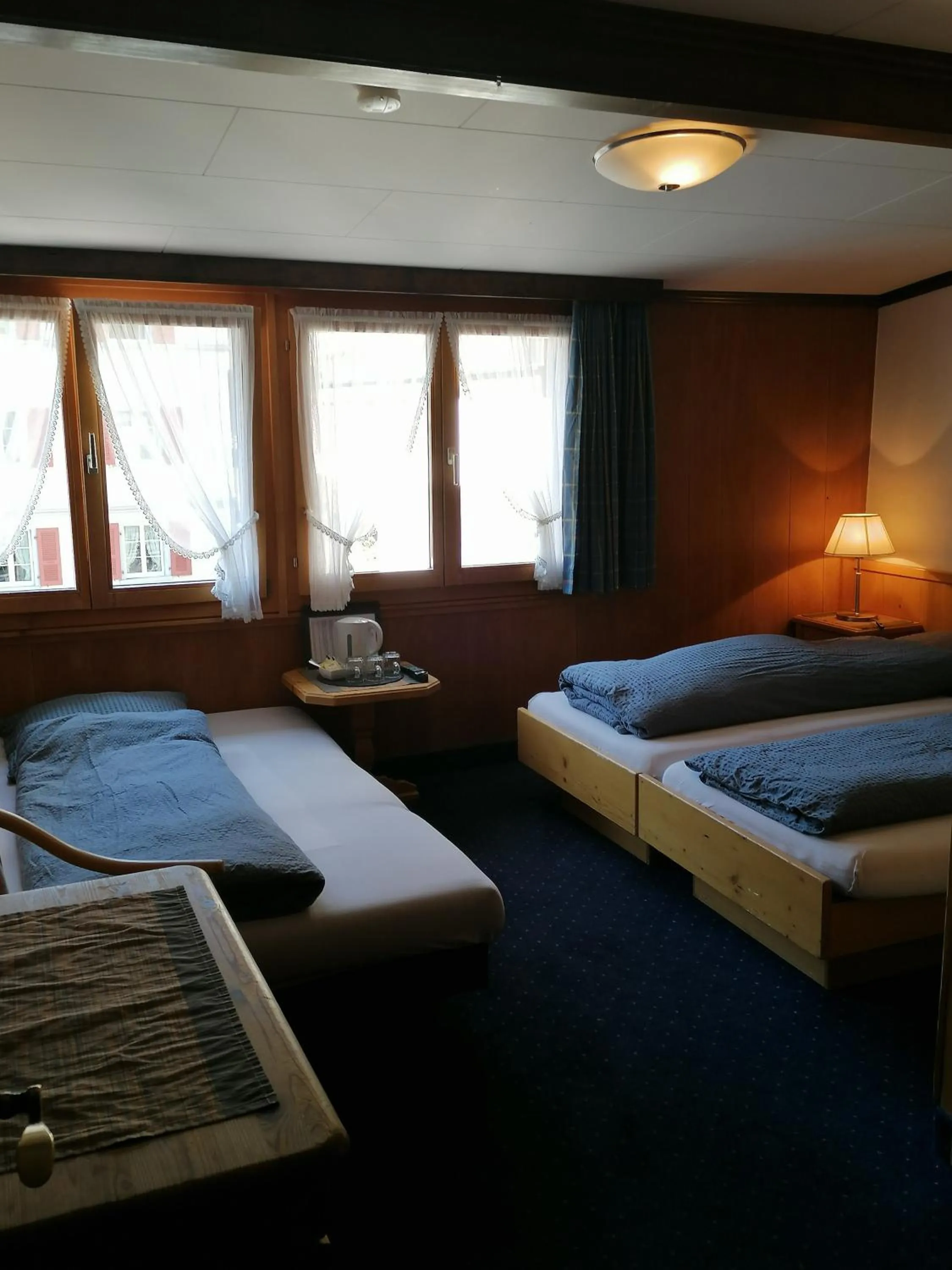 Photo of the whole room, Bed in Petit Helvetia Budget Hotel