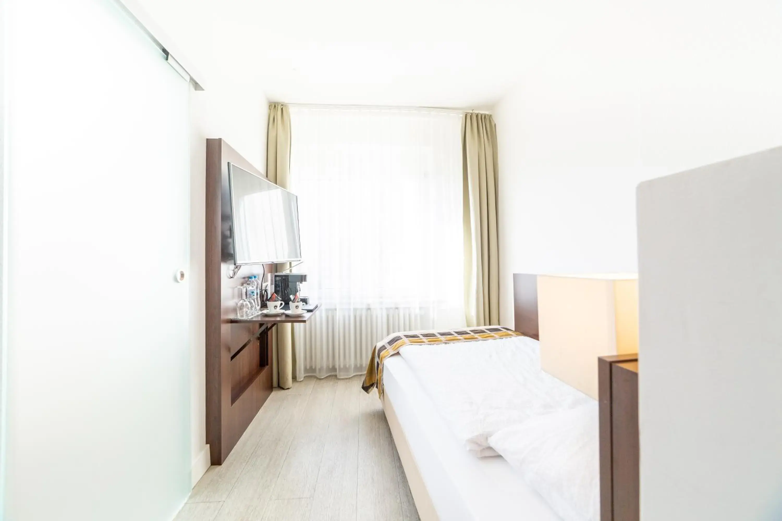 Bed in Hotel Rheinfelderhof Bed in Hotel Rheinfelderhof