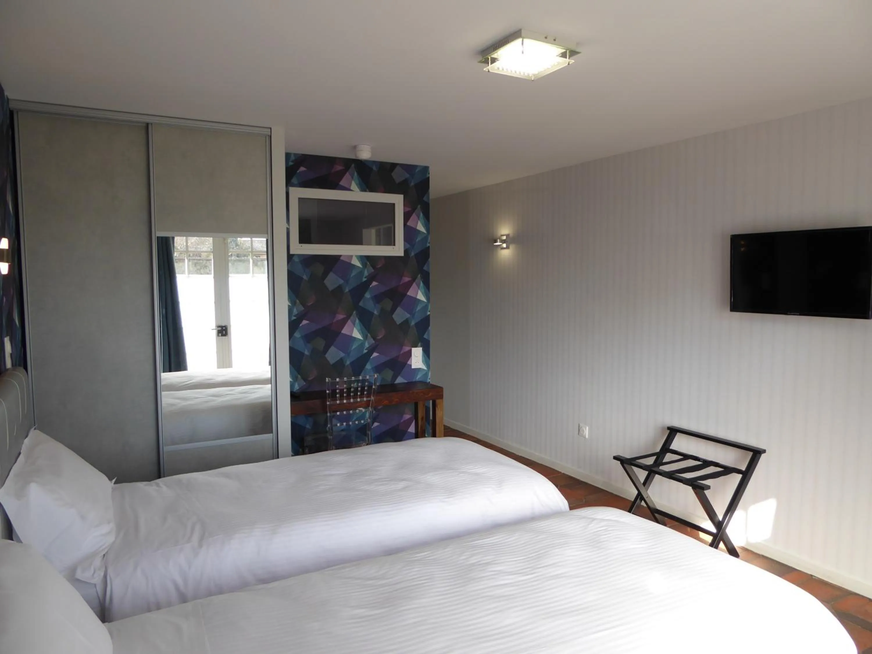 Bed in Logis Hôtel L'Arche de Noé