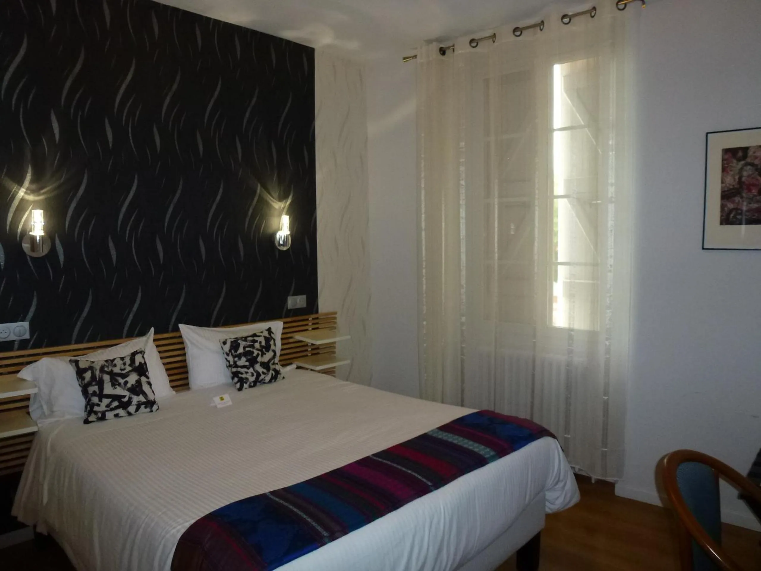 Bed in Logis Hôtel L'Arche de Noé