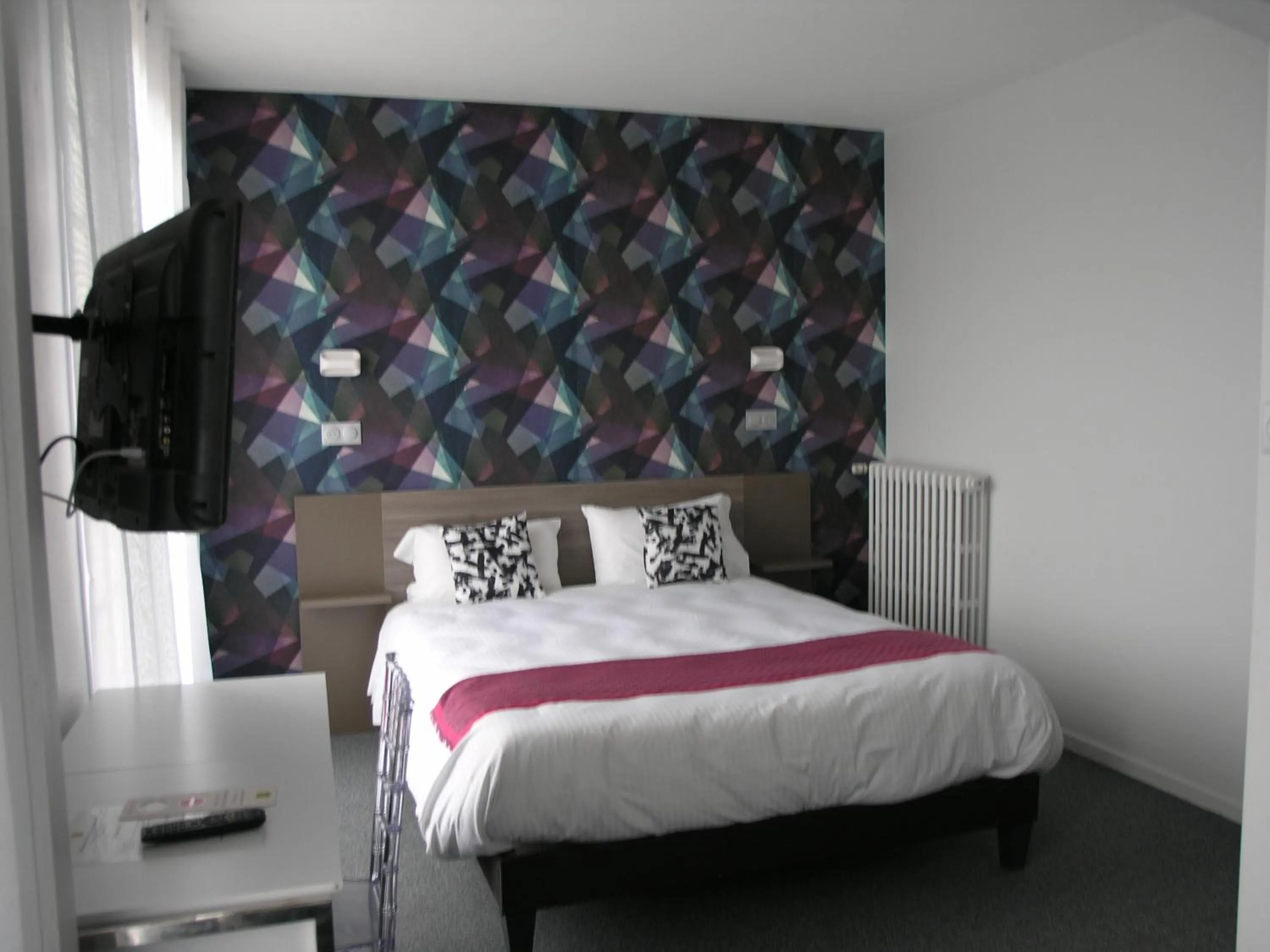 Bed in Logis Hôtel L'Arche de Noé