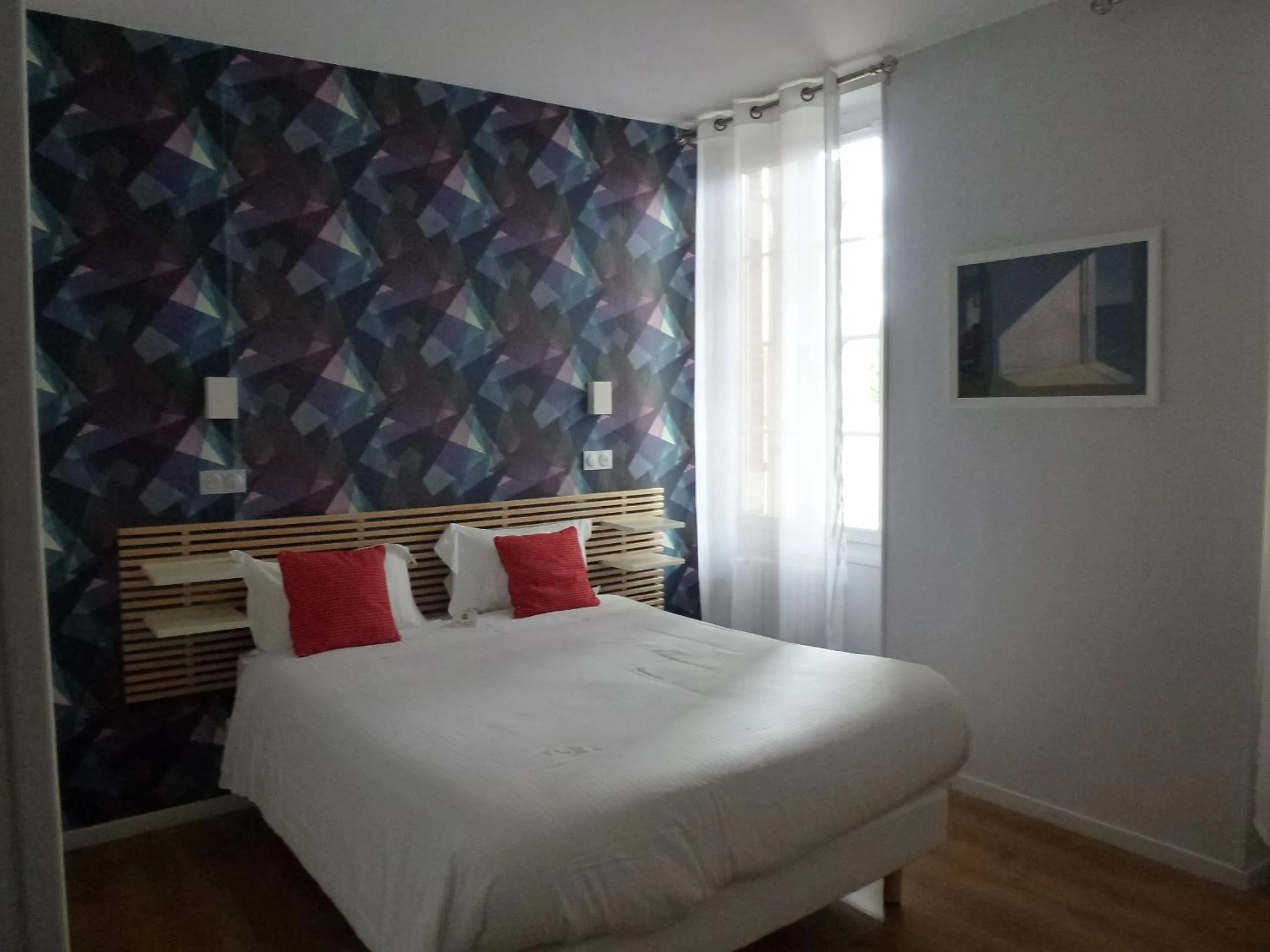 Bed in Logis Hôtel L'Arche de Noé