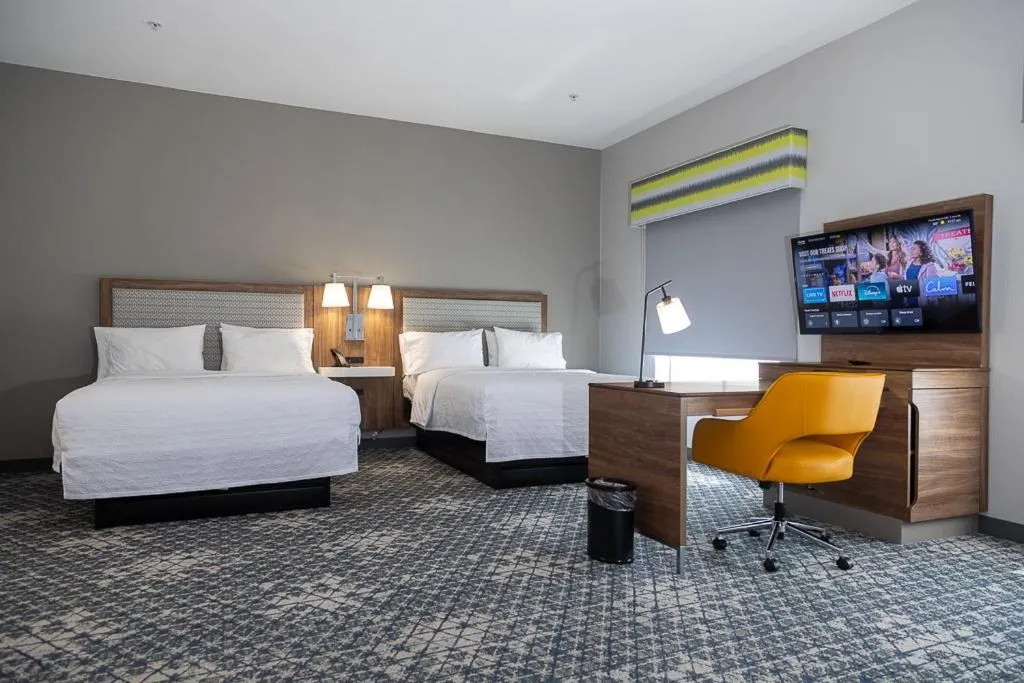 Bed in Hampton Inn & Suites Houston Rosenberg