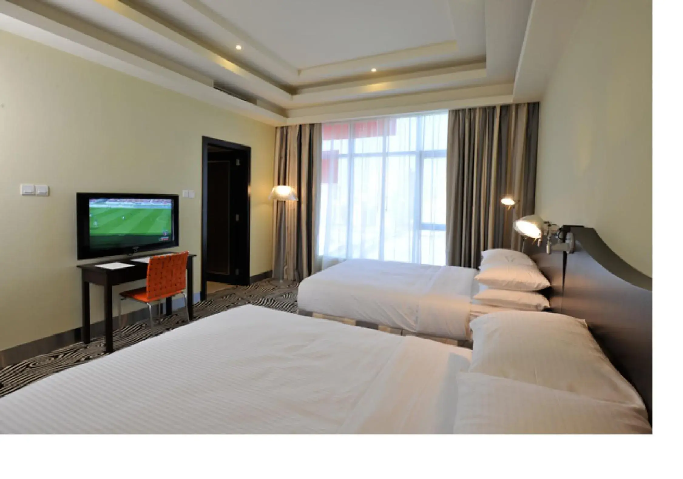 Bed in Al Raya Suites