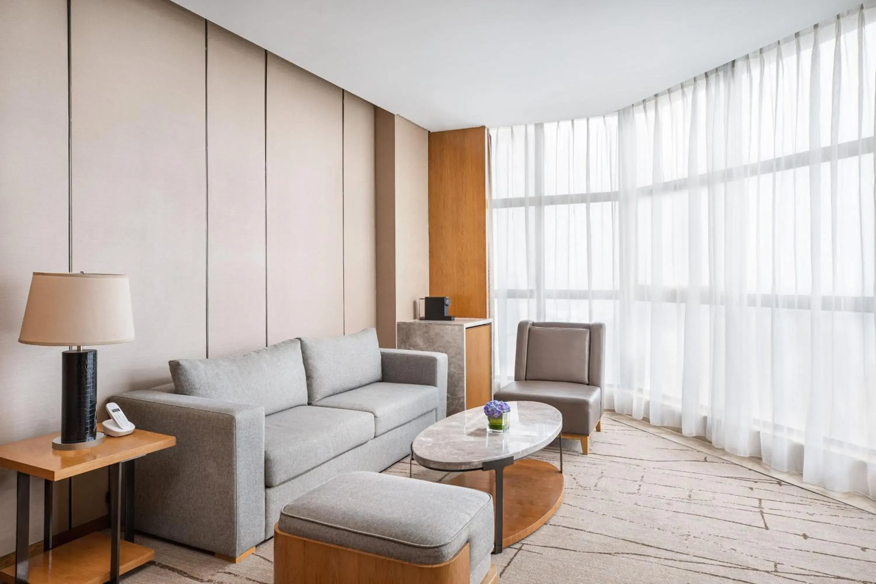 Living room in Four Points by Sheraton Shanghai, Kangqiao Living room in Four Points by Sheraton Shanghai, Kangqiao