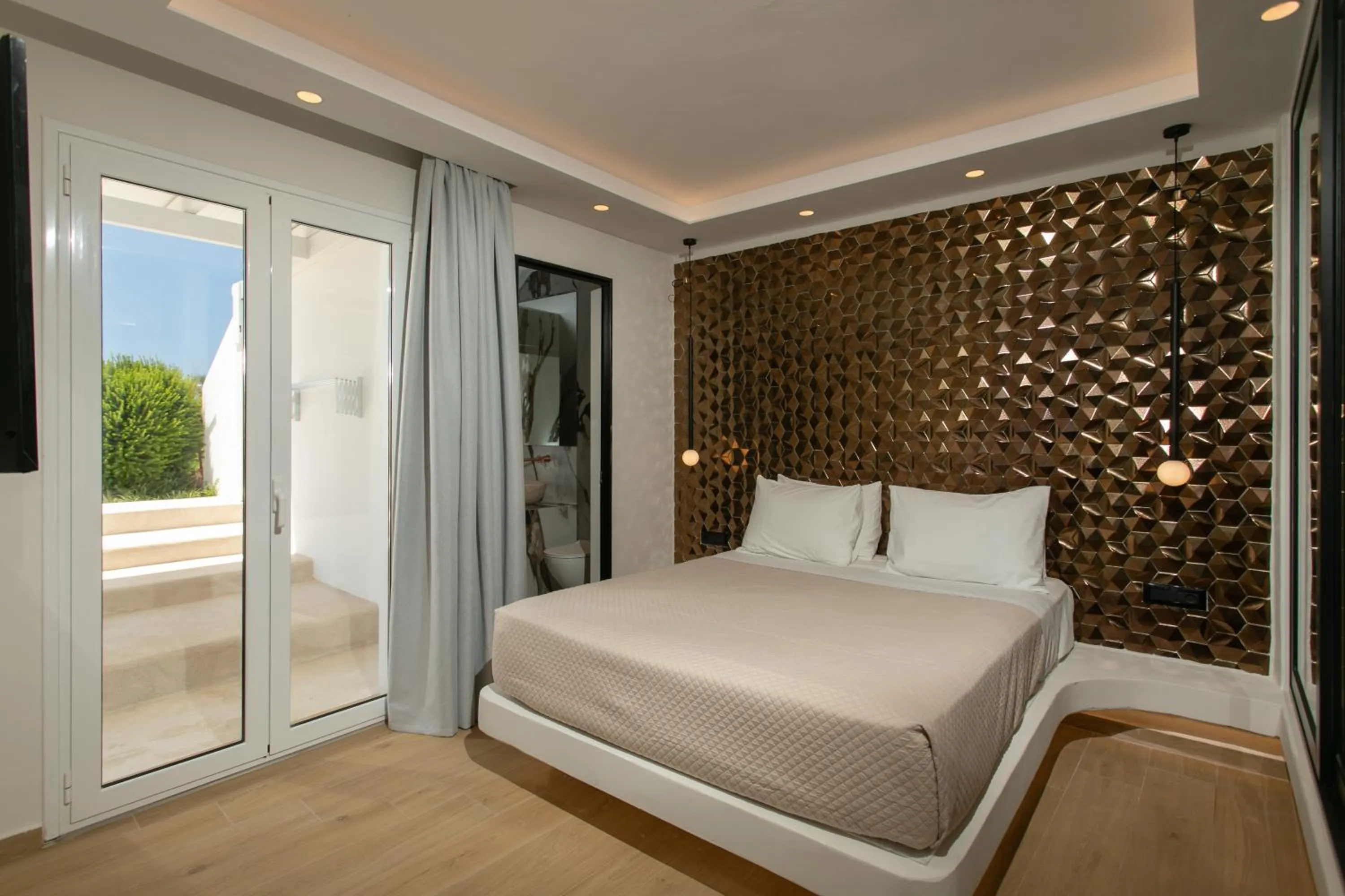 Bed in Iphimedeia Luxury Hotel & Suites