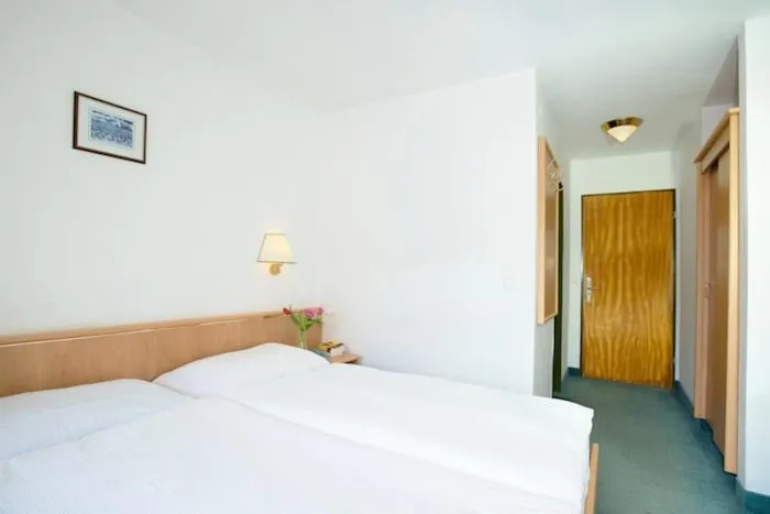 Photo of the whole room, Bed in Gornergrat Dorf Hotel
