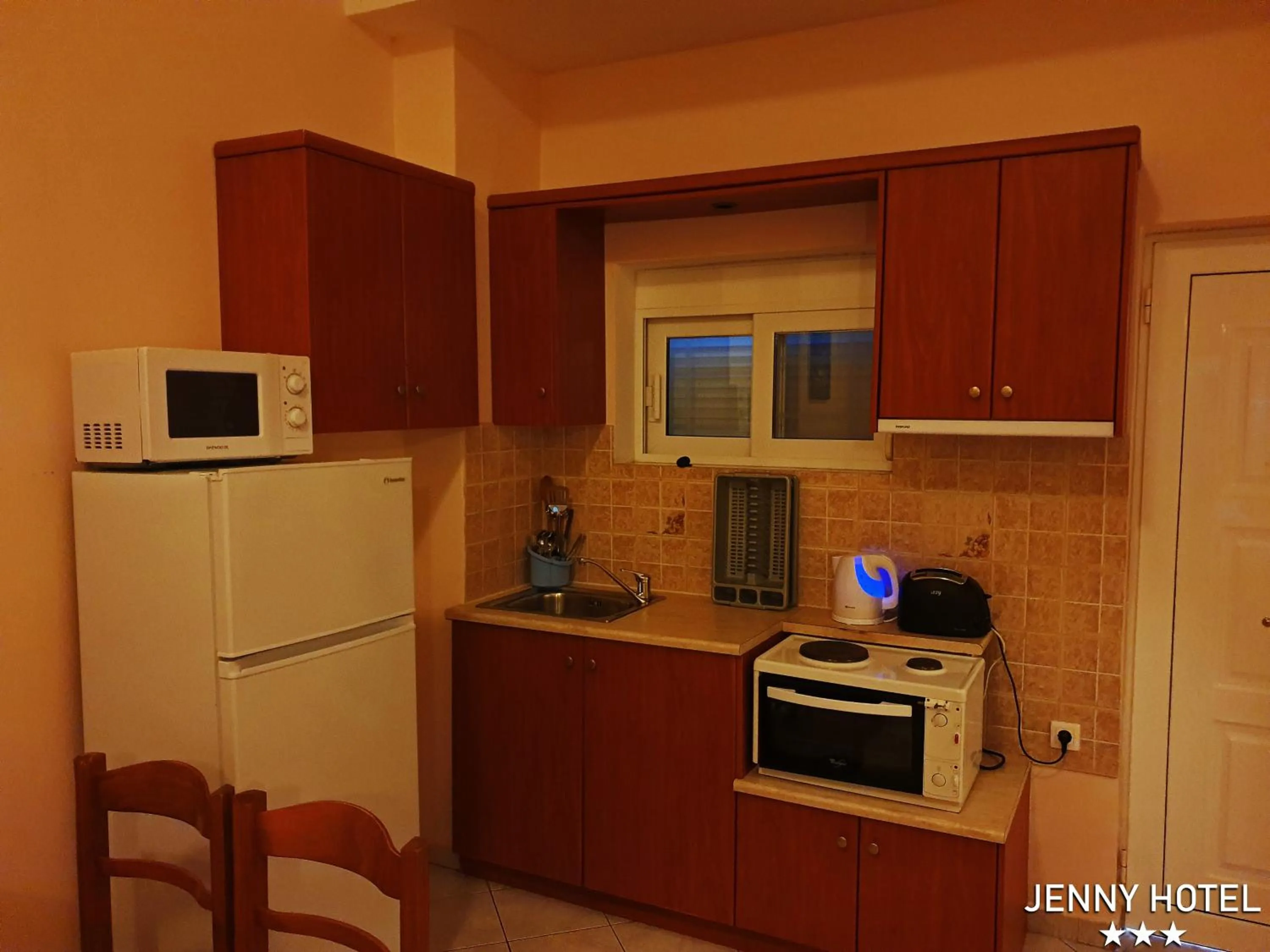 Kitchen or kitchenette in Jenny Hotel