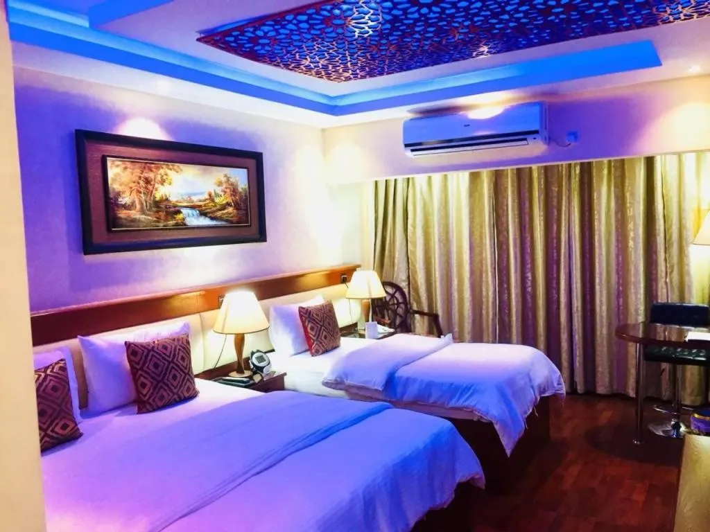 Bed in Trans World Hotel