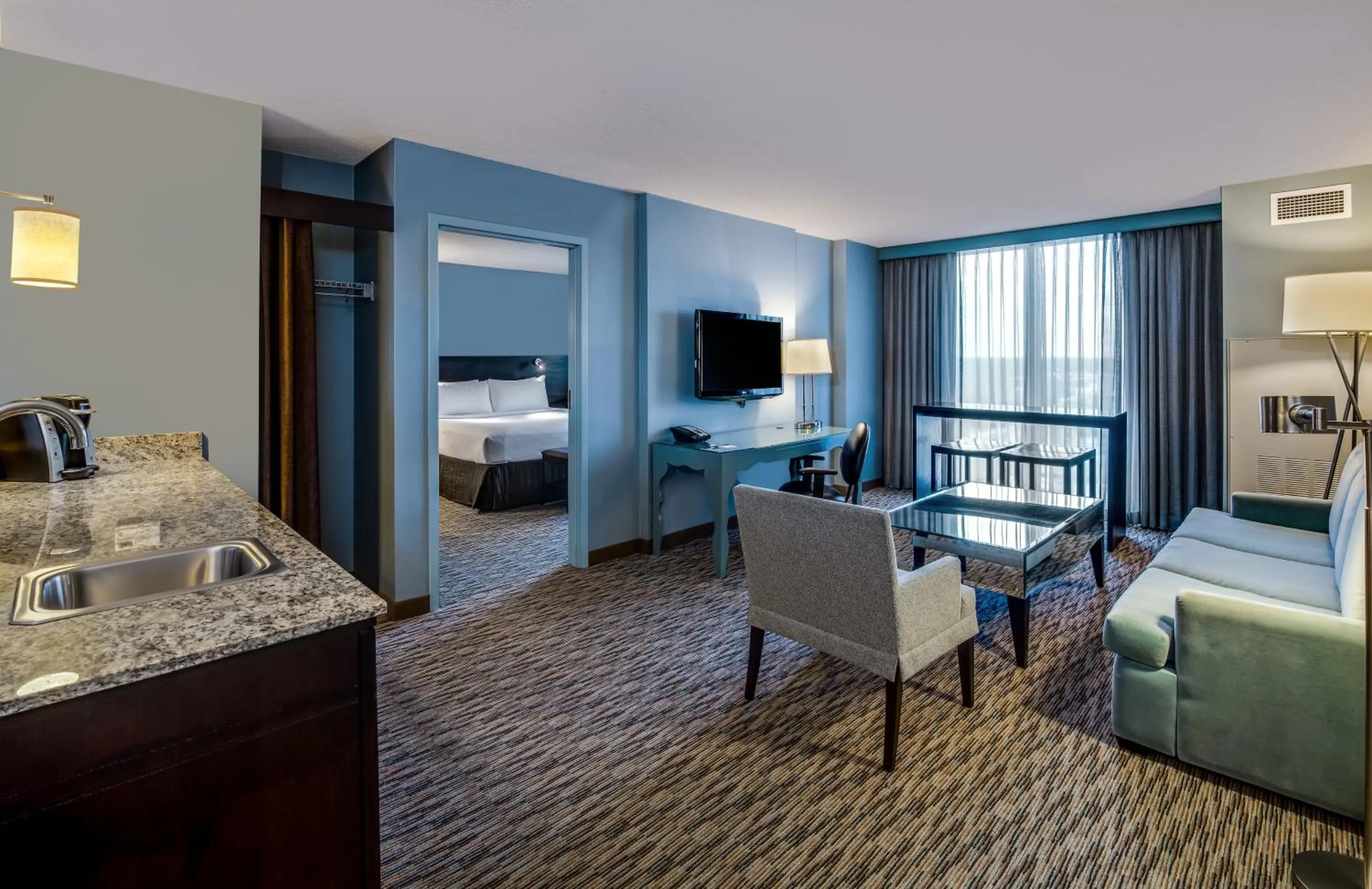 Seating area, Bed in Crowne Plaza Chicago O'Hare Hotel & Conference Center by IHG