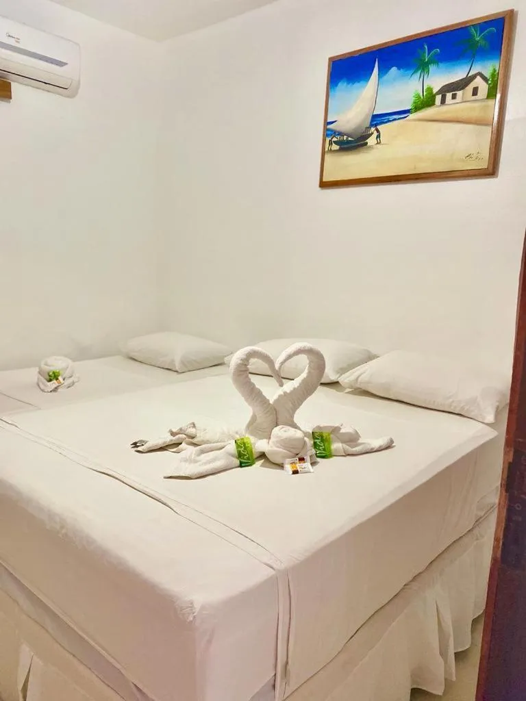 Bed in Pousada Quatro Irmãos