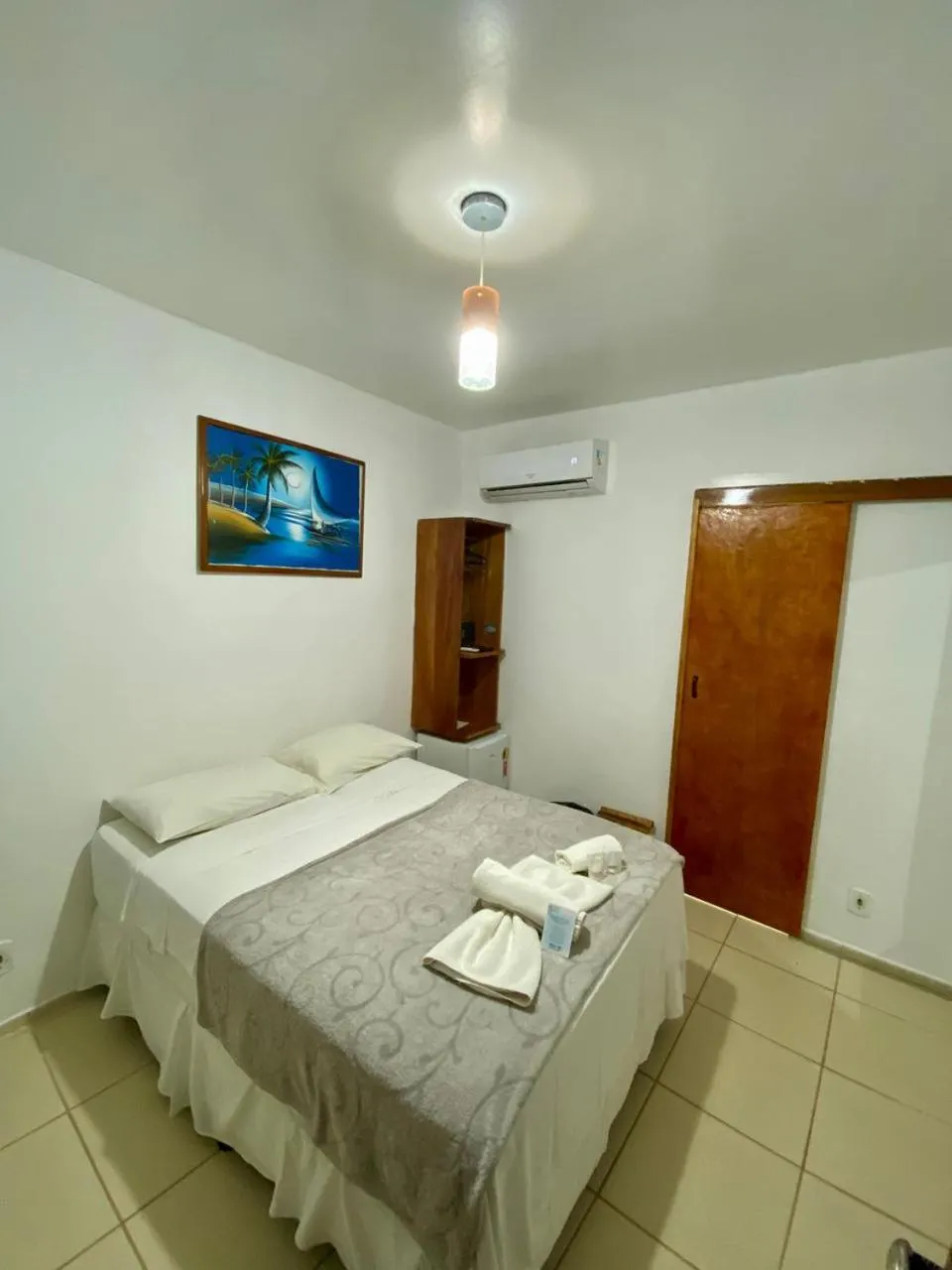 Bed in Pousada Quatro Irmãos