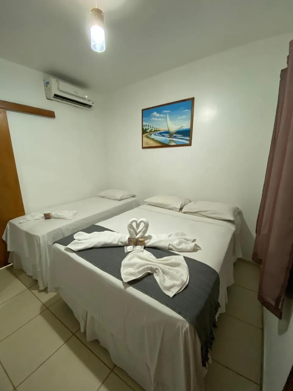 Bed in Pousada Quatro Irmãos