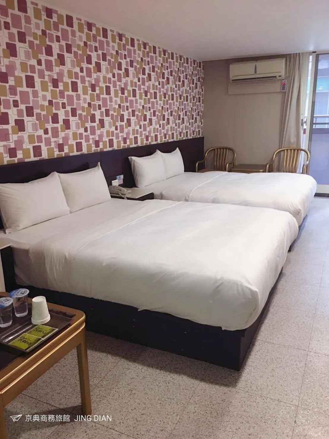 Bed in Jing Dian Business Hotel