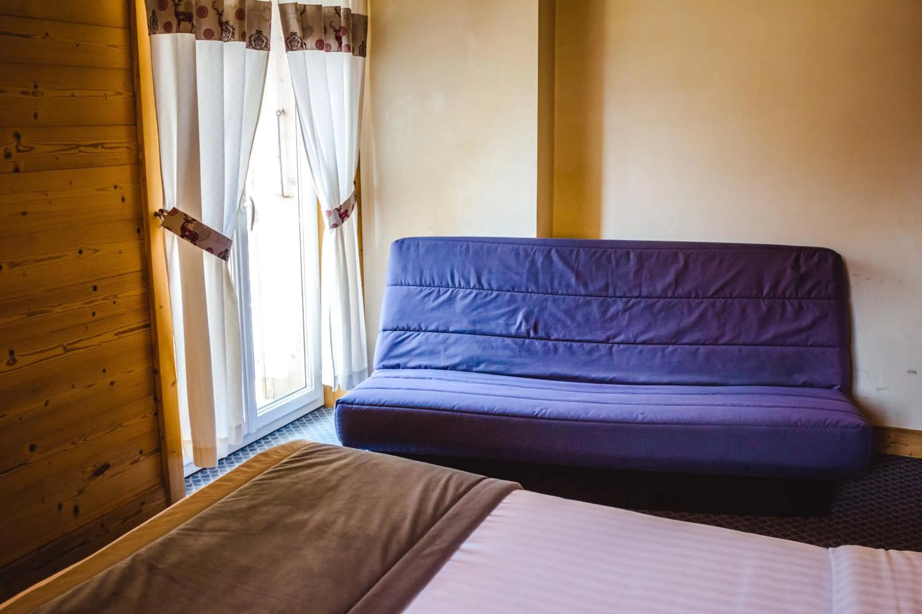 Bed in Le Relais Du Mont Blanc