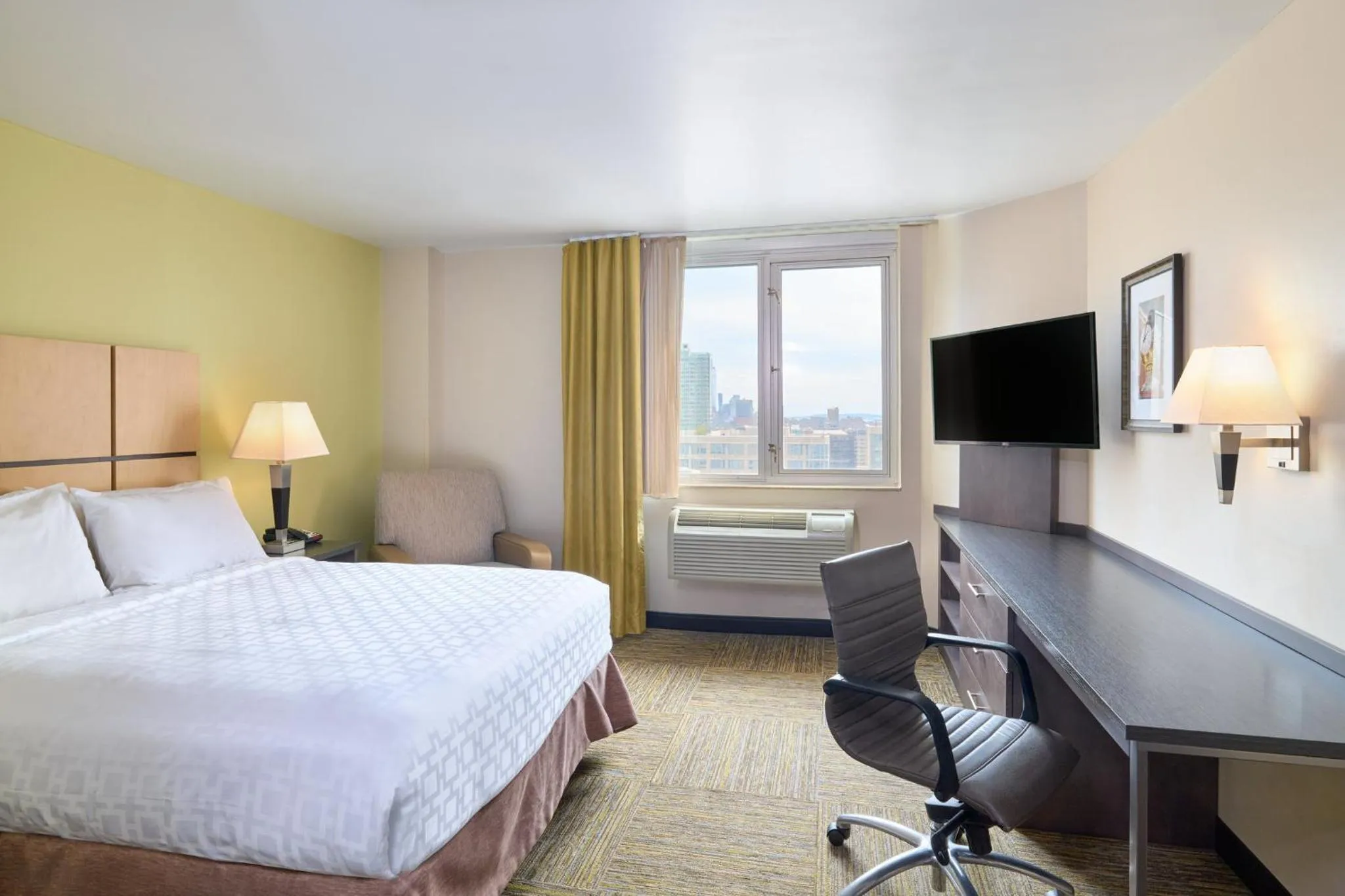 Photo of the whole room, Bed in Candlewood Suites NYC -Times Square by IHG