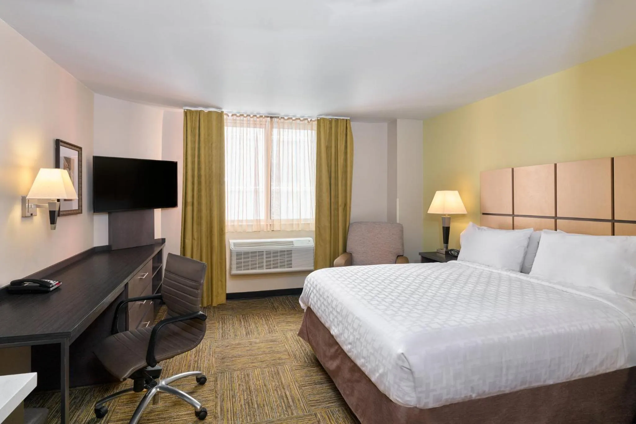 Photo of the whole room, Bed in Candlewood Suites NYC -Times Square by IHG