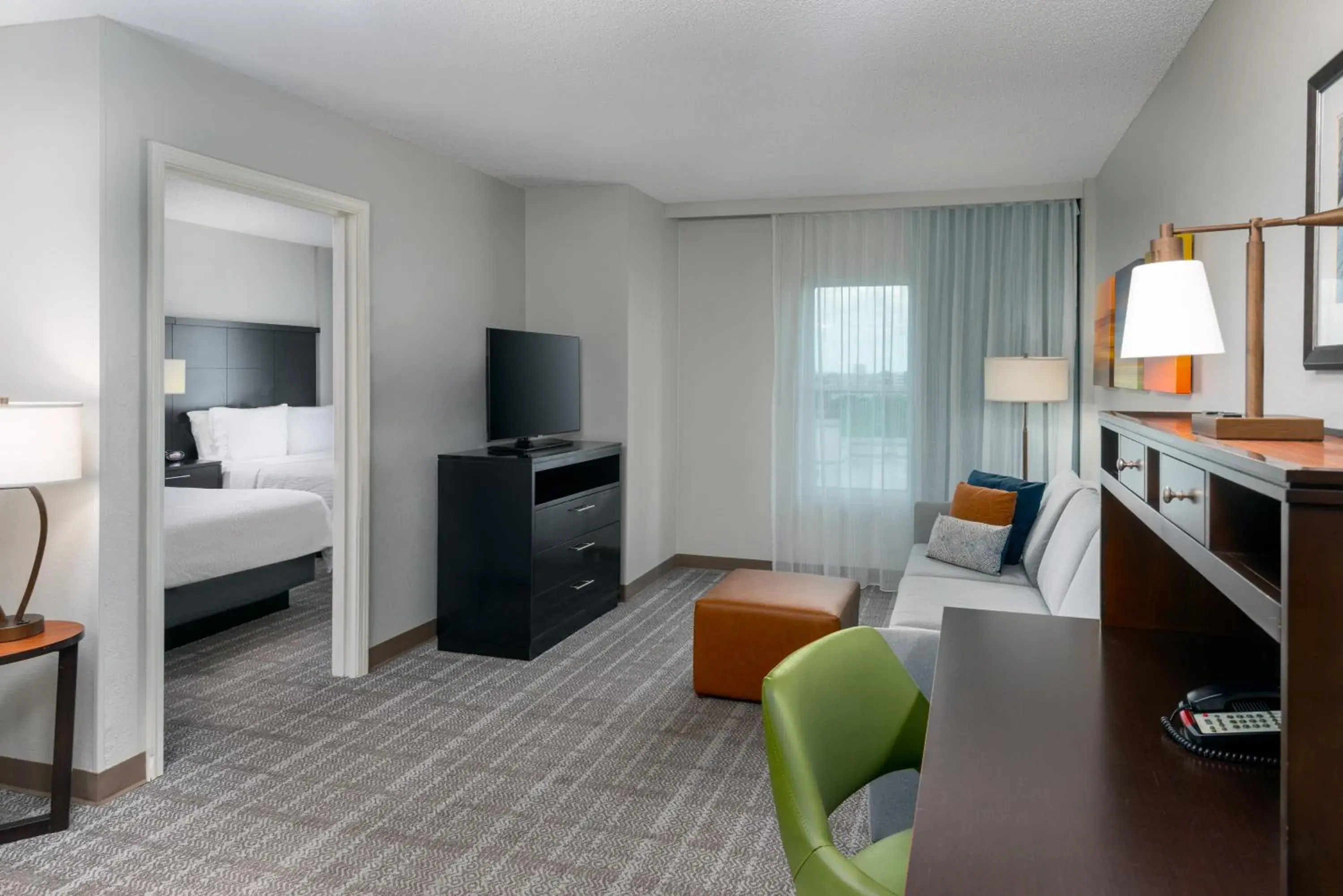 Living room, Bed in Staybridge Suites Miami Doral Area by IHG Living room, Bed in Staybridge Suites Miami Doral Area by IHG