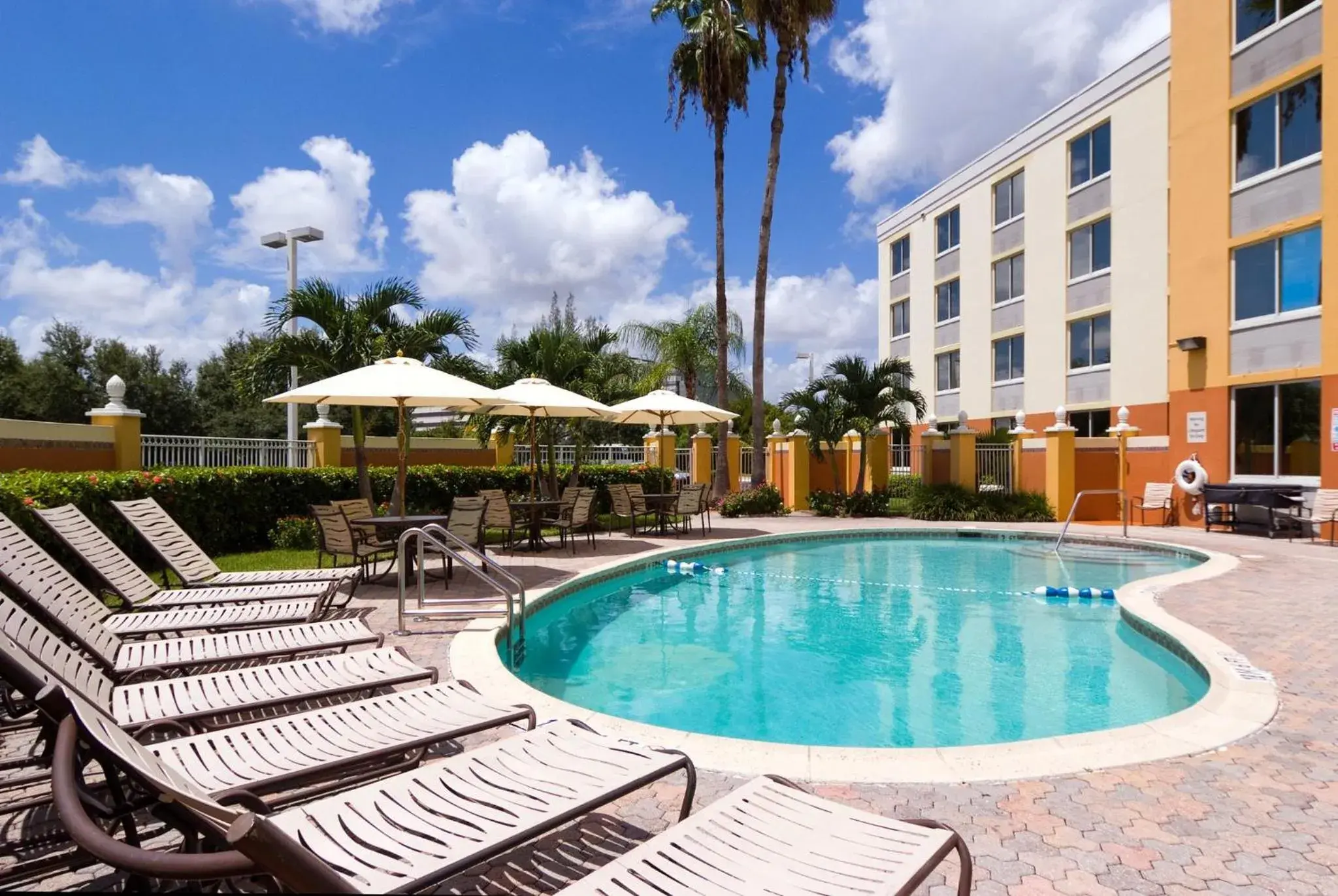 Swimming pool in Holiday Inn Express Miami Airport Doral Area by IHG Swimming pool in Holiday Inn Express Miami Airport Doral Area by IHG