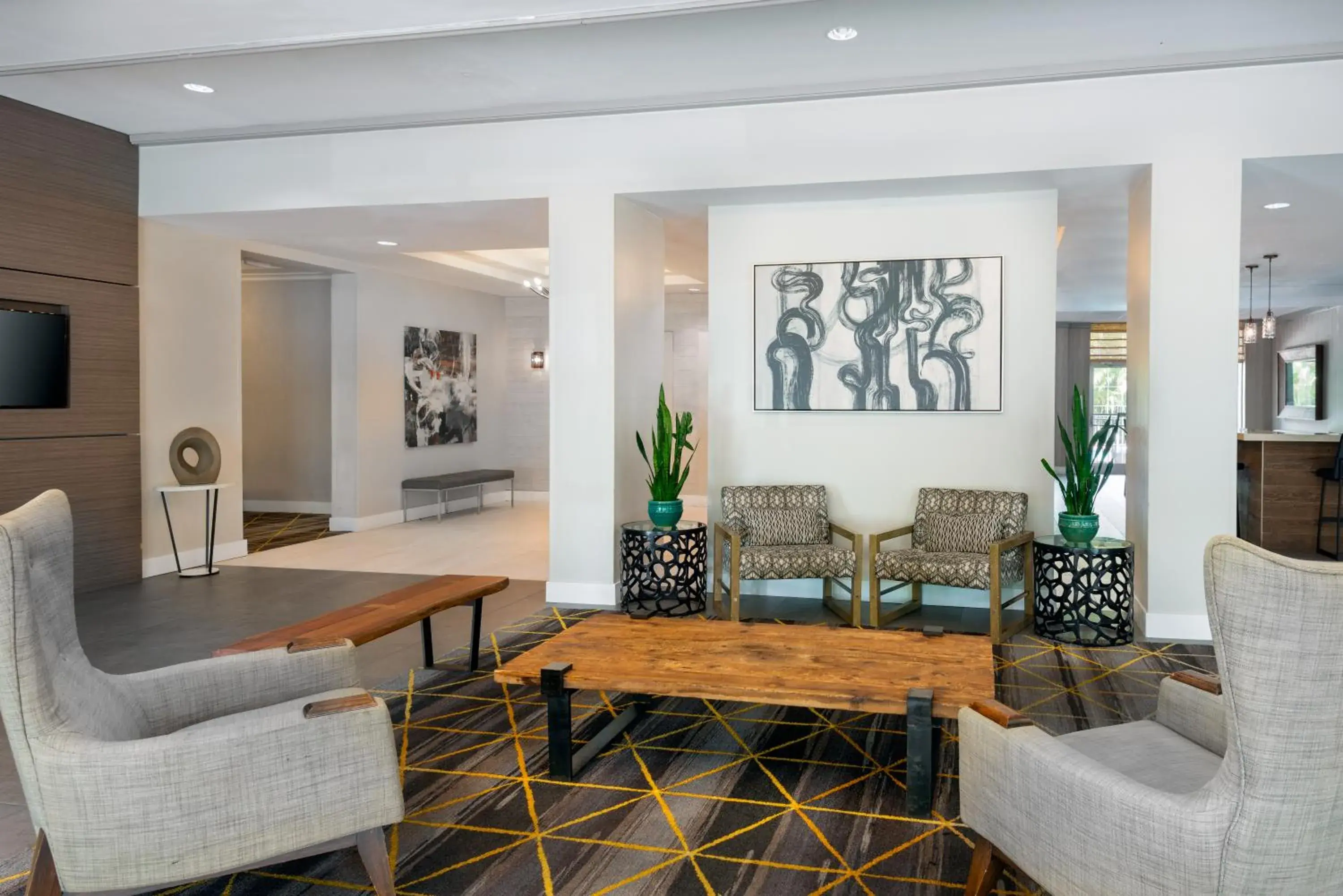 Lobby or reception in Holiday Inn Miami-Doral Area by IHG Lobby or reception in Holiday Inn Miami-Doral Area by IHG