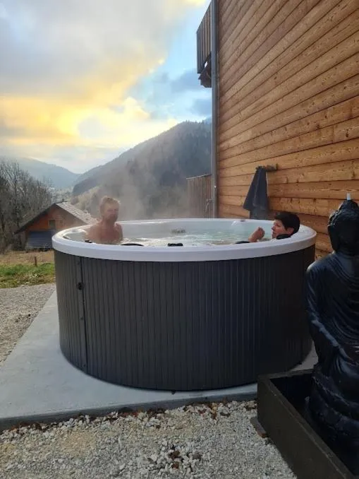 Hot Tub in Le Chalet Du Blanc Spa yoga