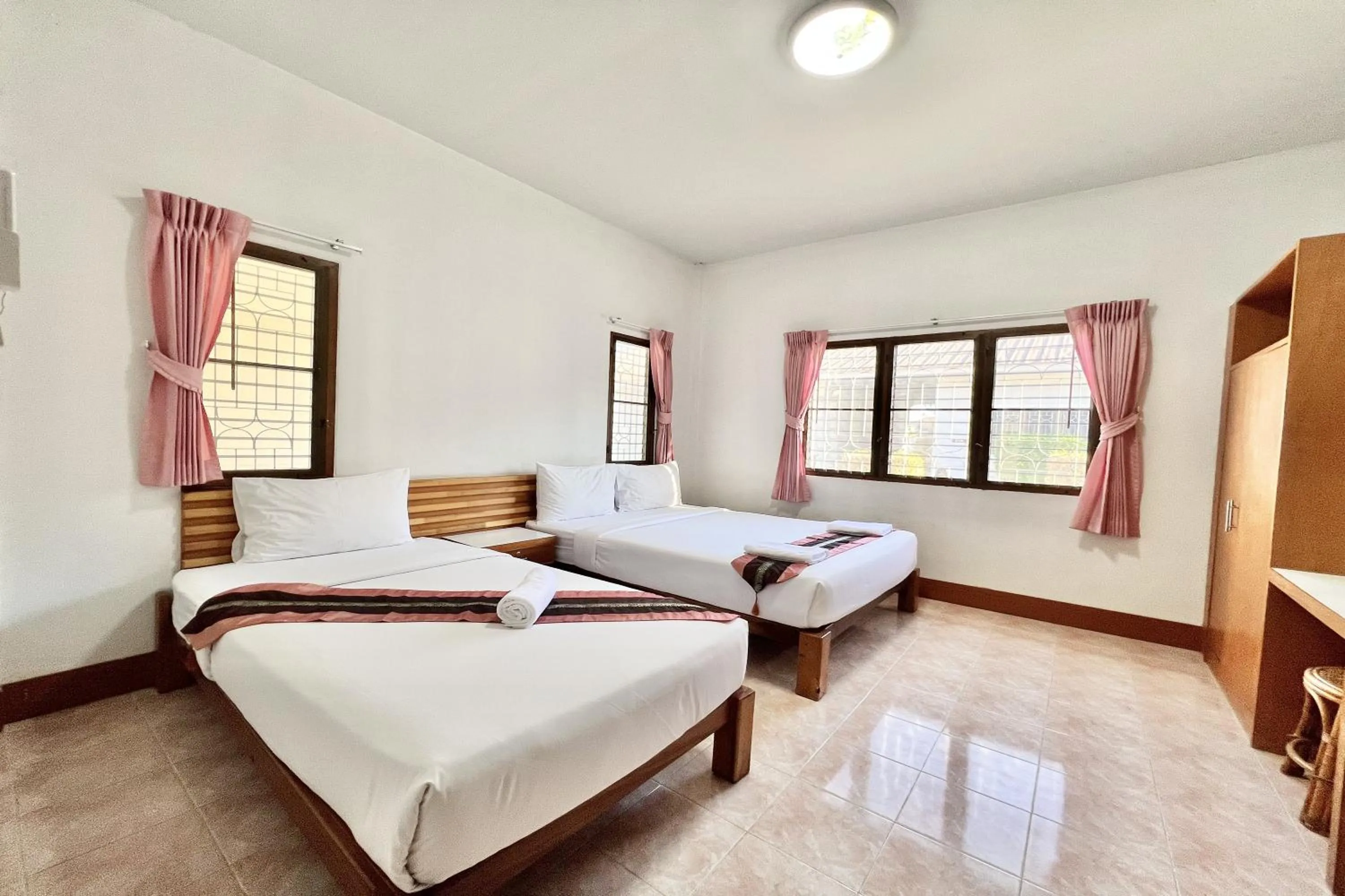 Bed in Ruentara Resort & Villa