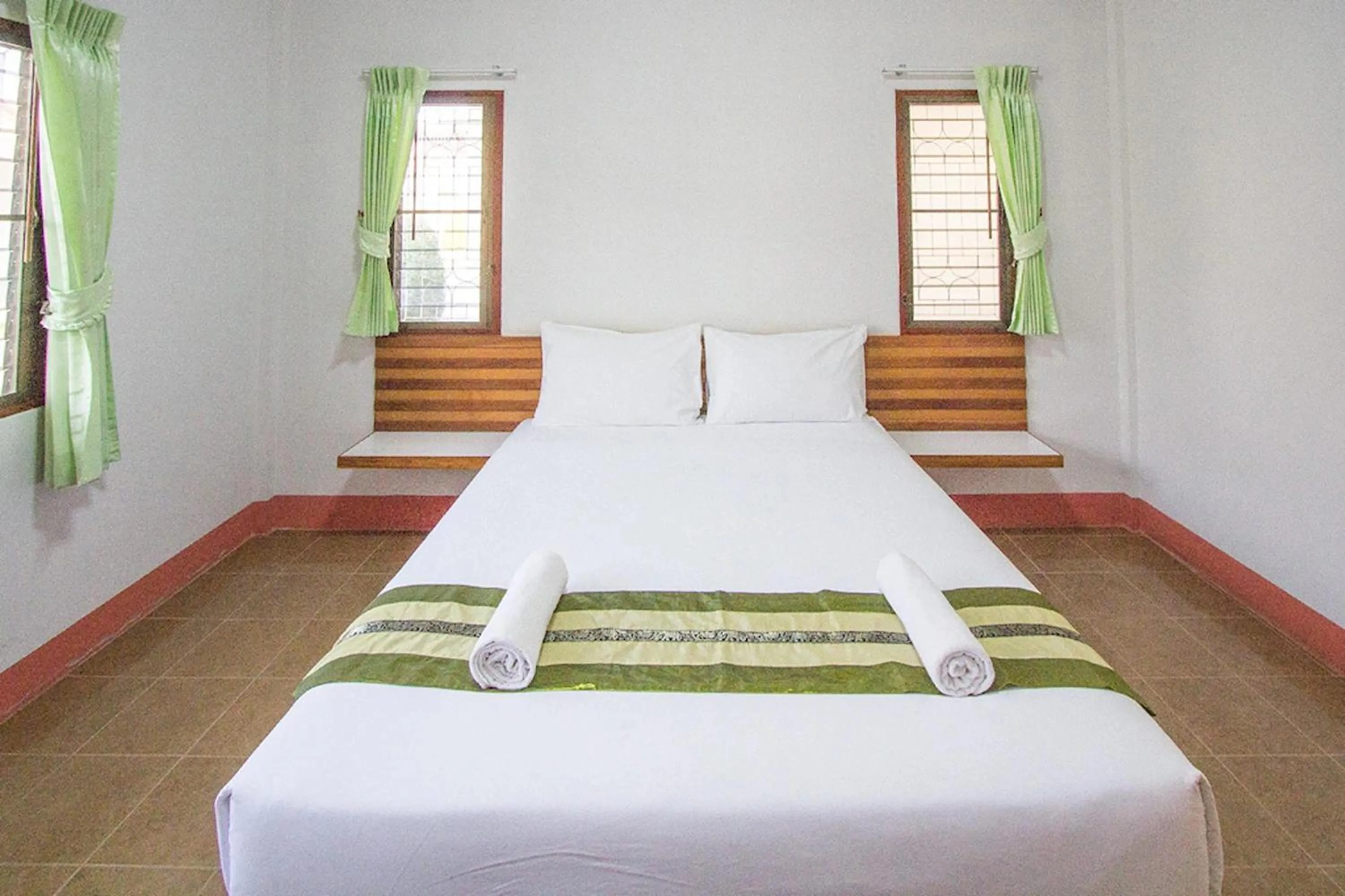 Bed in Ruentara Resort & Villa