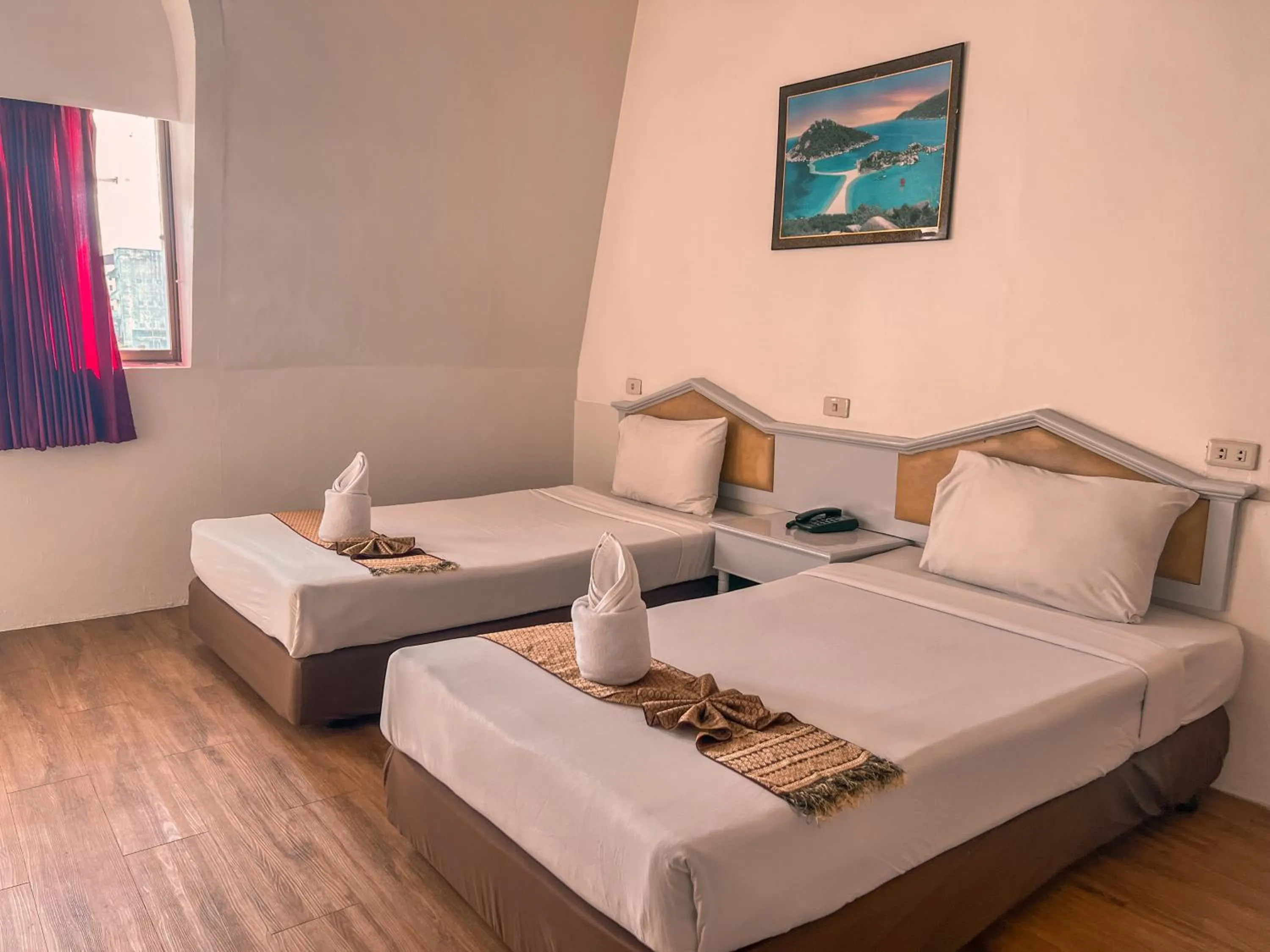 Bed in Merlin Grand Hotel