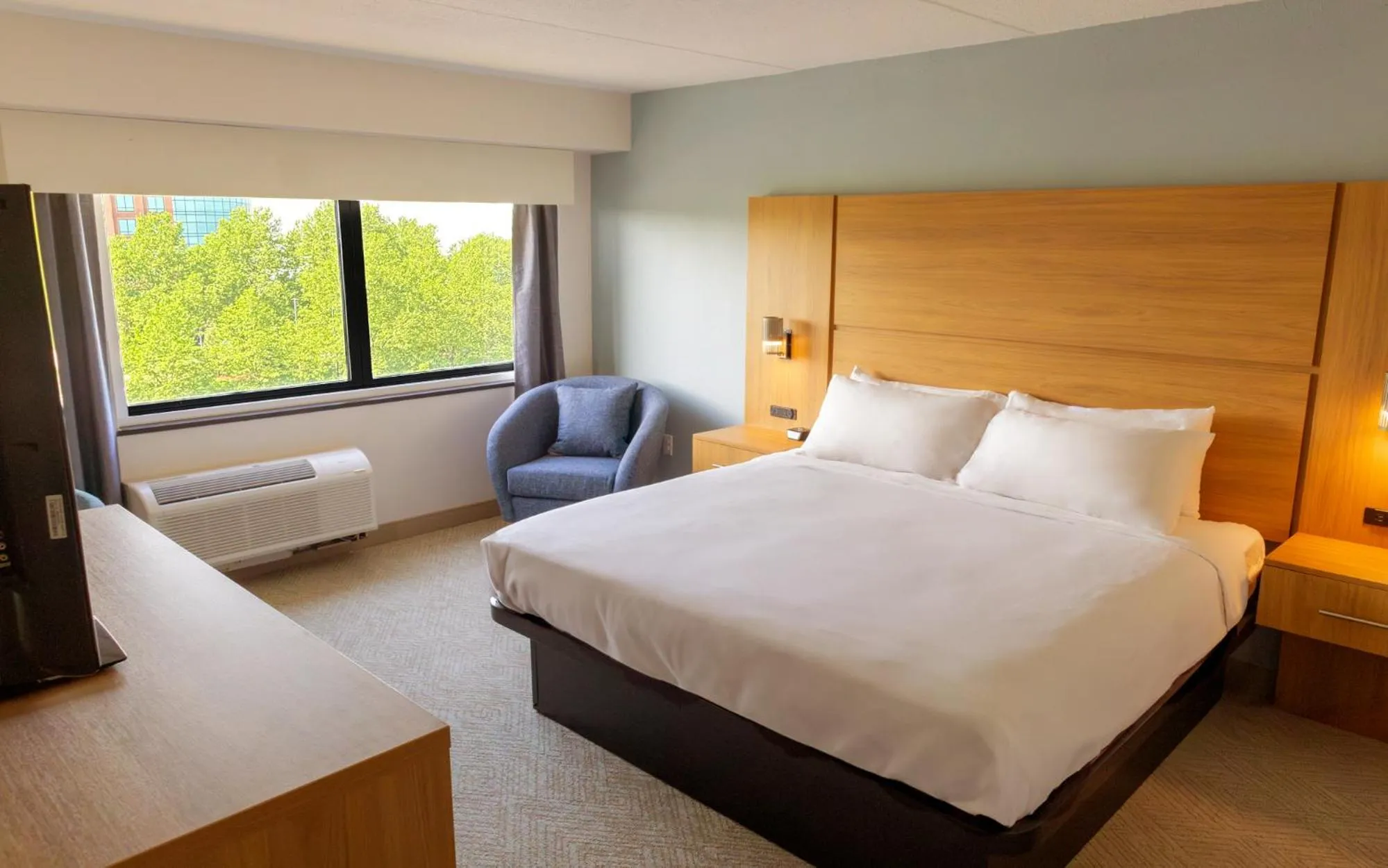 Bedroom in Elimwood Hotel, a Ramada by Wyndham