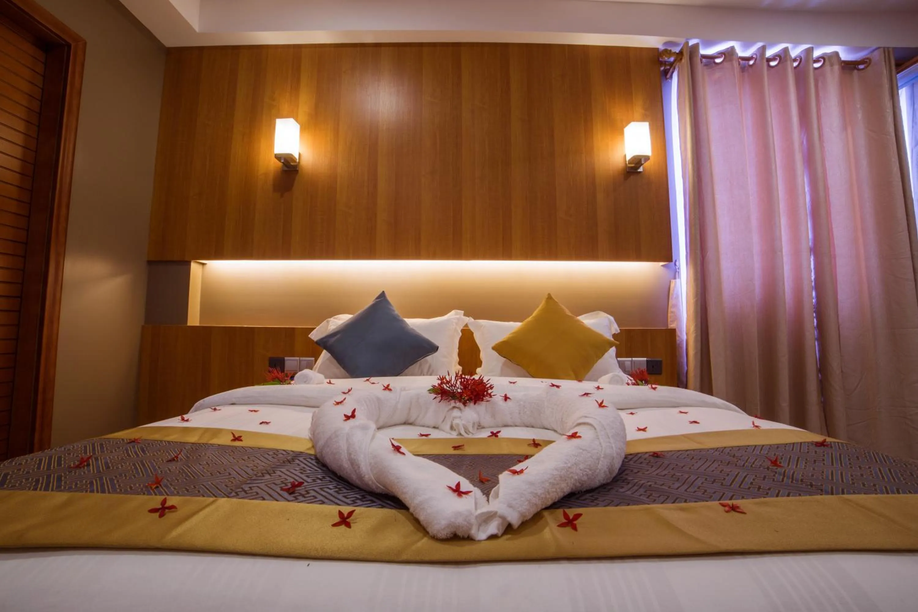 Bed in Kuredhi Beach Inn