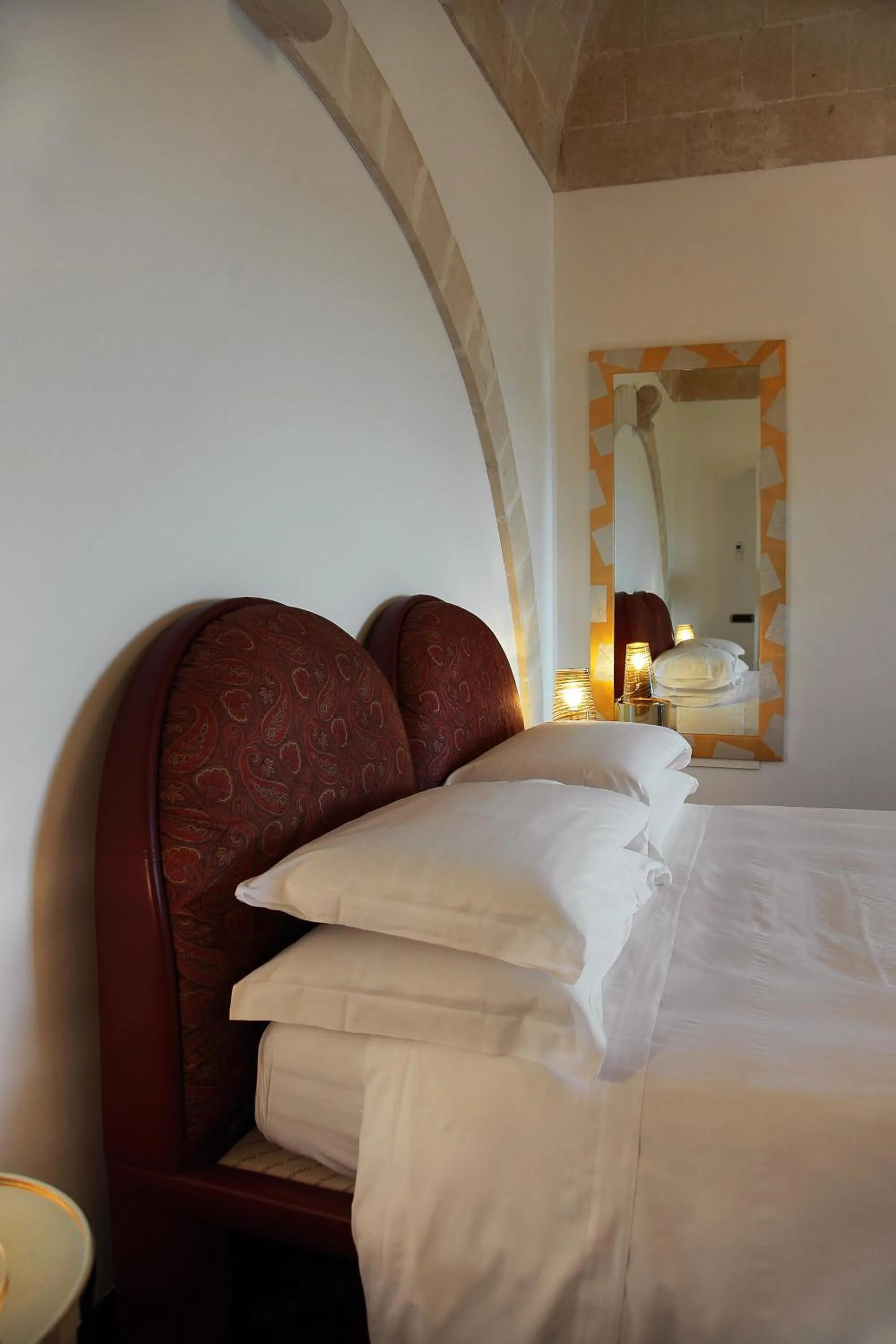 Bed in Antica Civita Luxury Room