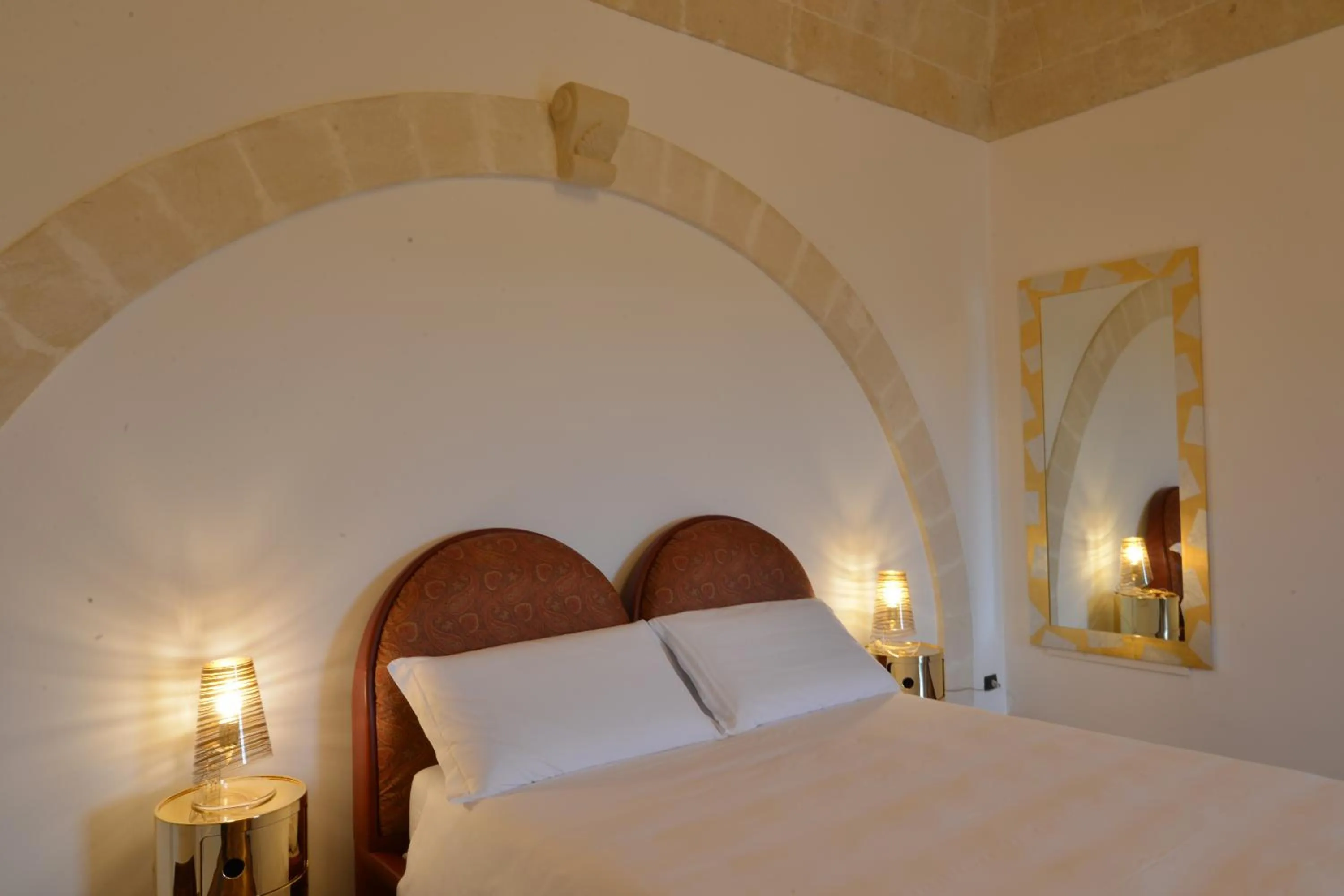 Bed in Antica Civita Luxury Room