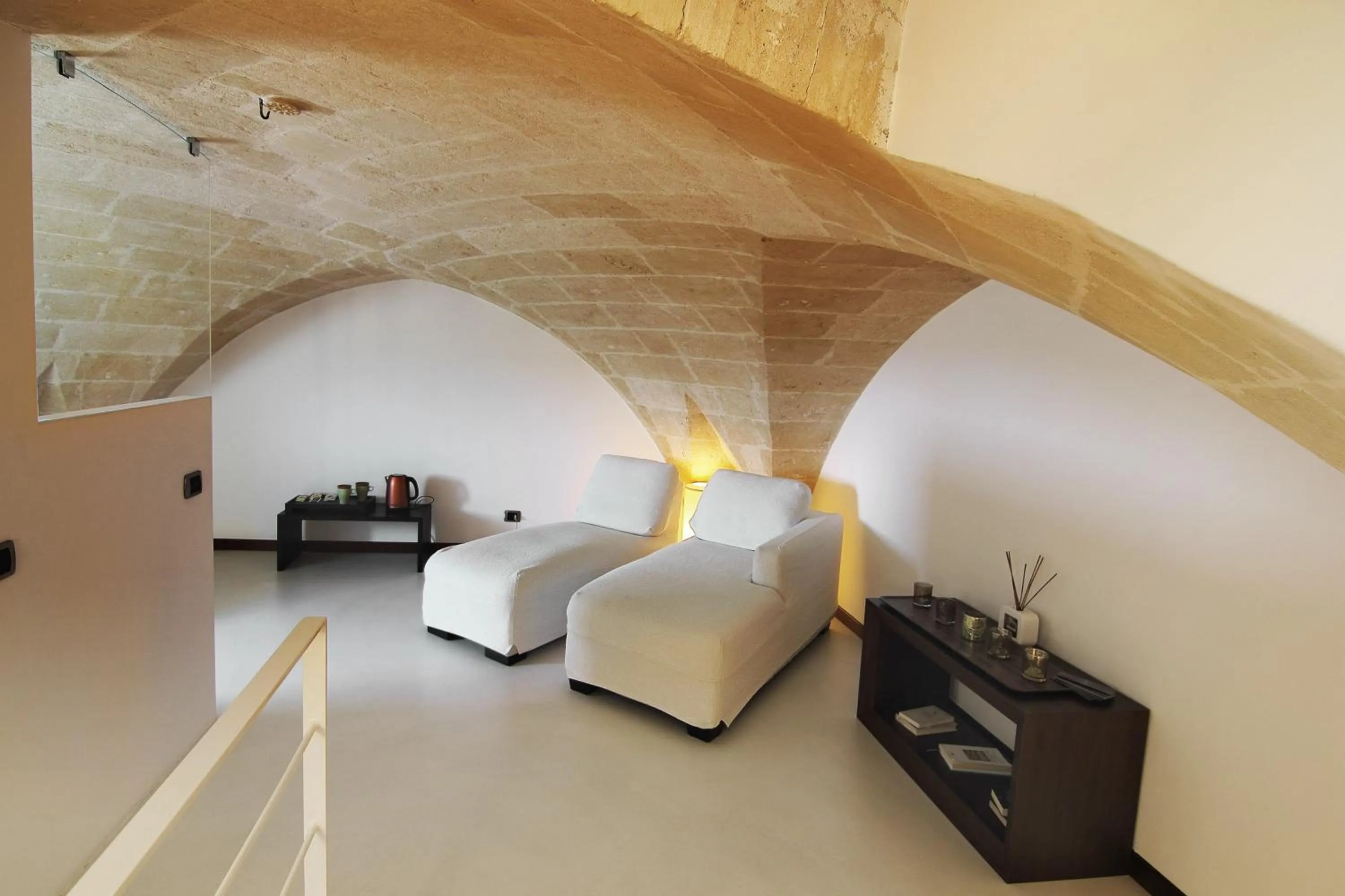 Seating area, Bed in Antica Civita Luxury Room