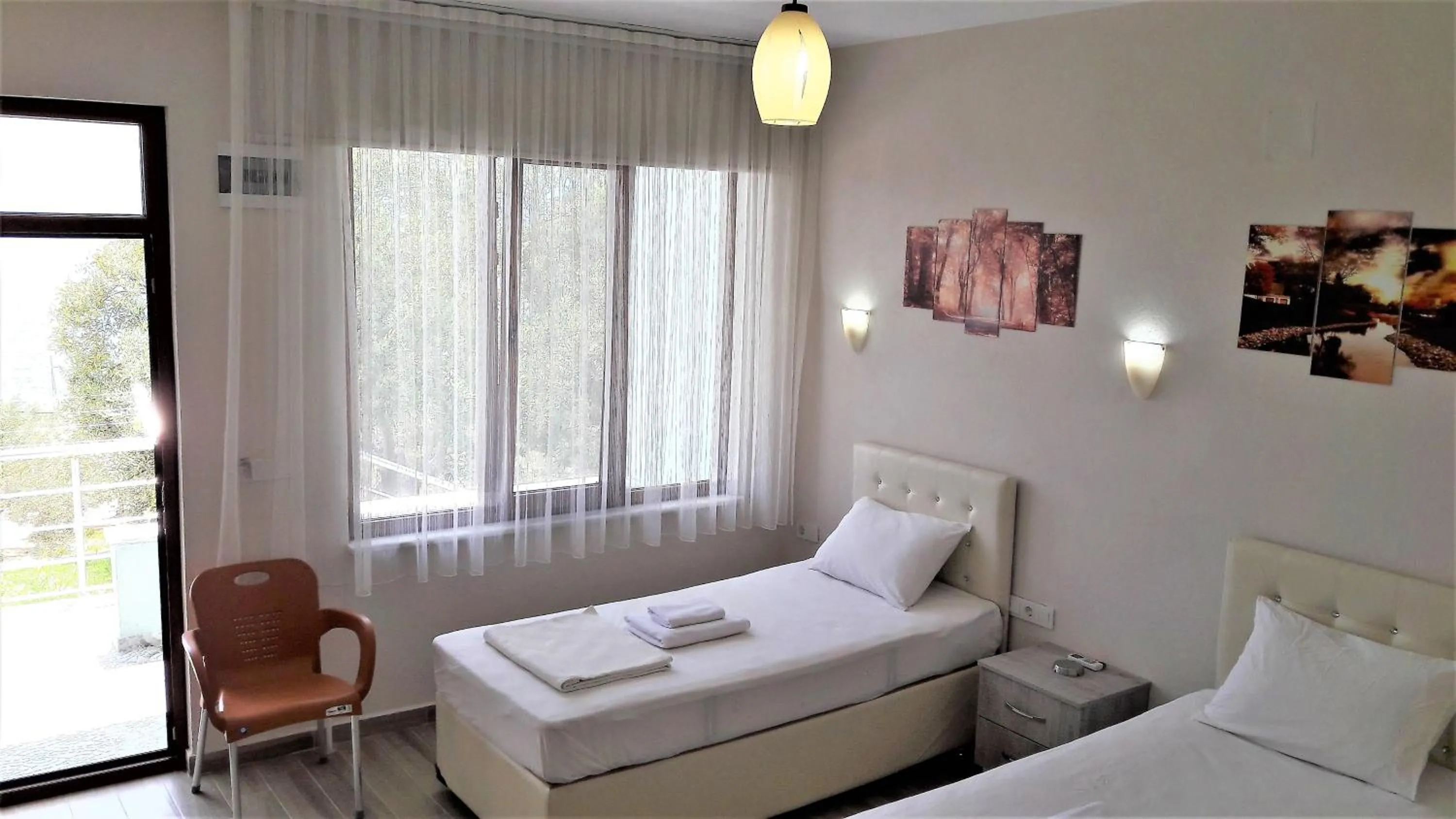 Photo of the whole room, Bed in Assos Nazan Motel Restoran Beach