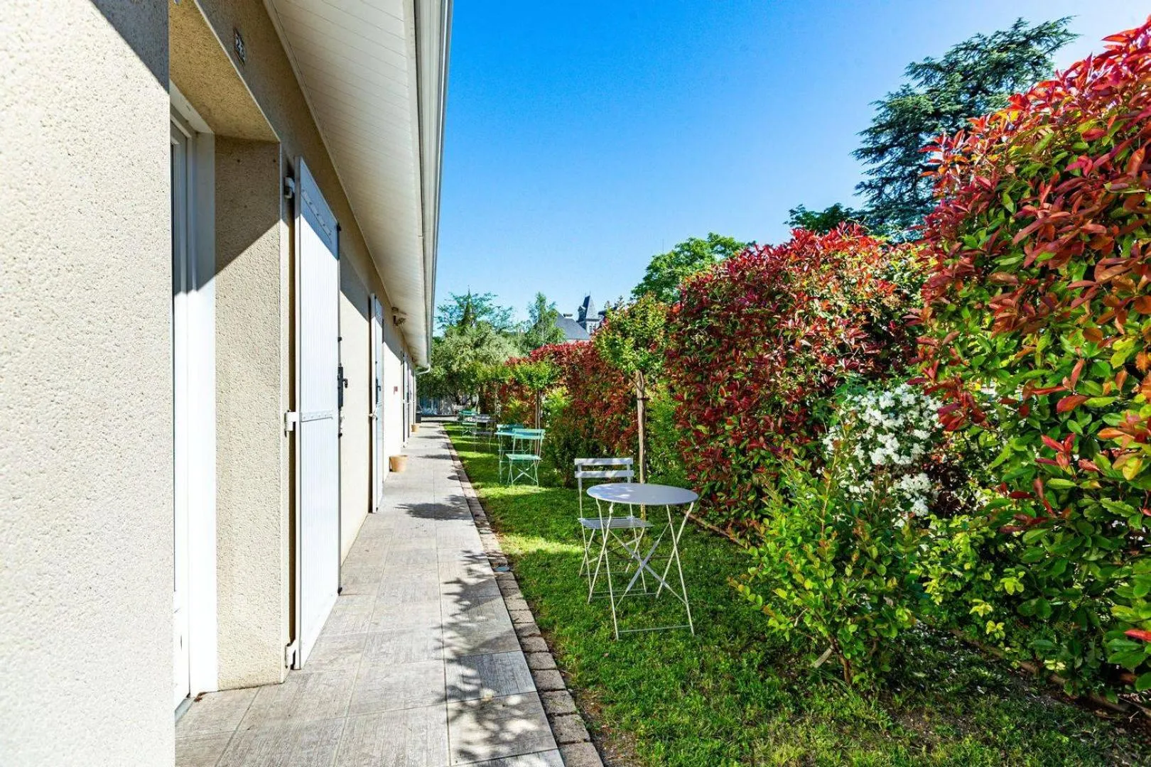Garden in Logis Hôtel L'Oliveraie
