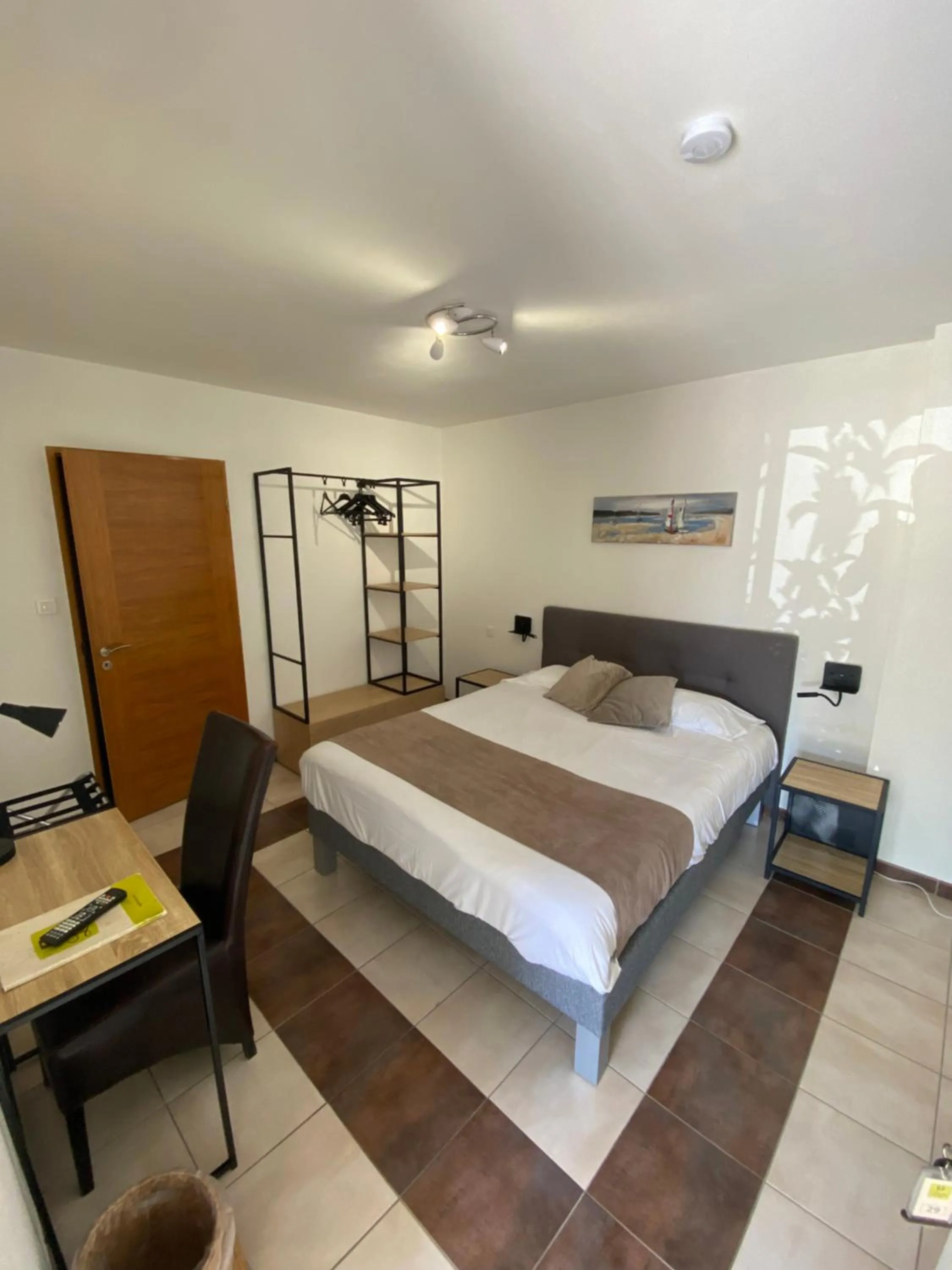 Bed in Logis Hôtel L'Oliveraie