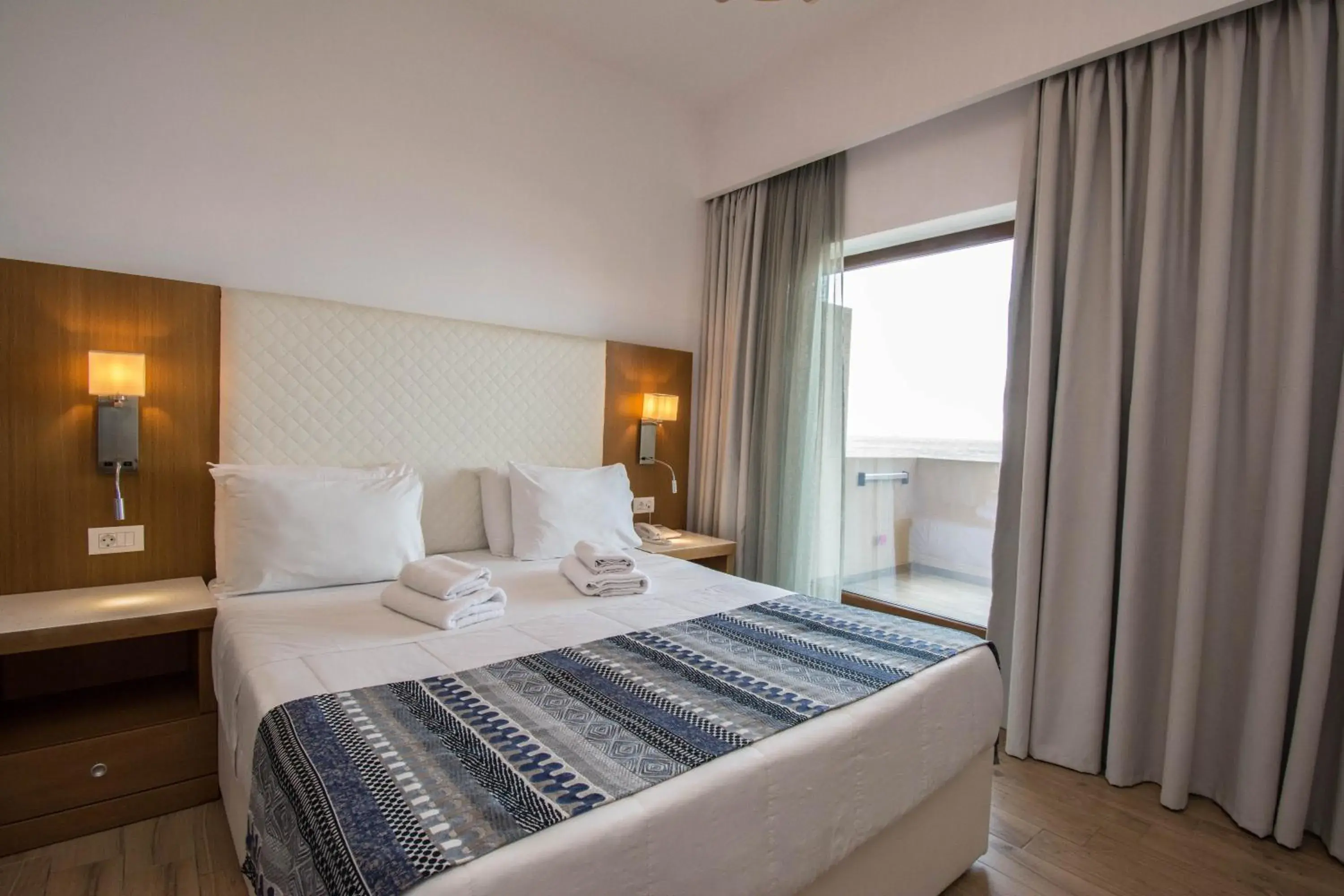 Bedroom, Bed in Yianna Caravel Suites "by Checkin" adults only Bedroom, Bed in Yianna Caravel Suites "by Checkin" adults only