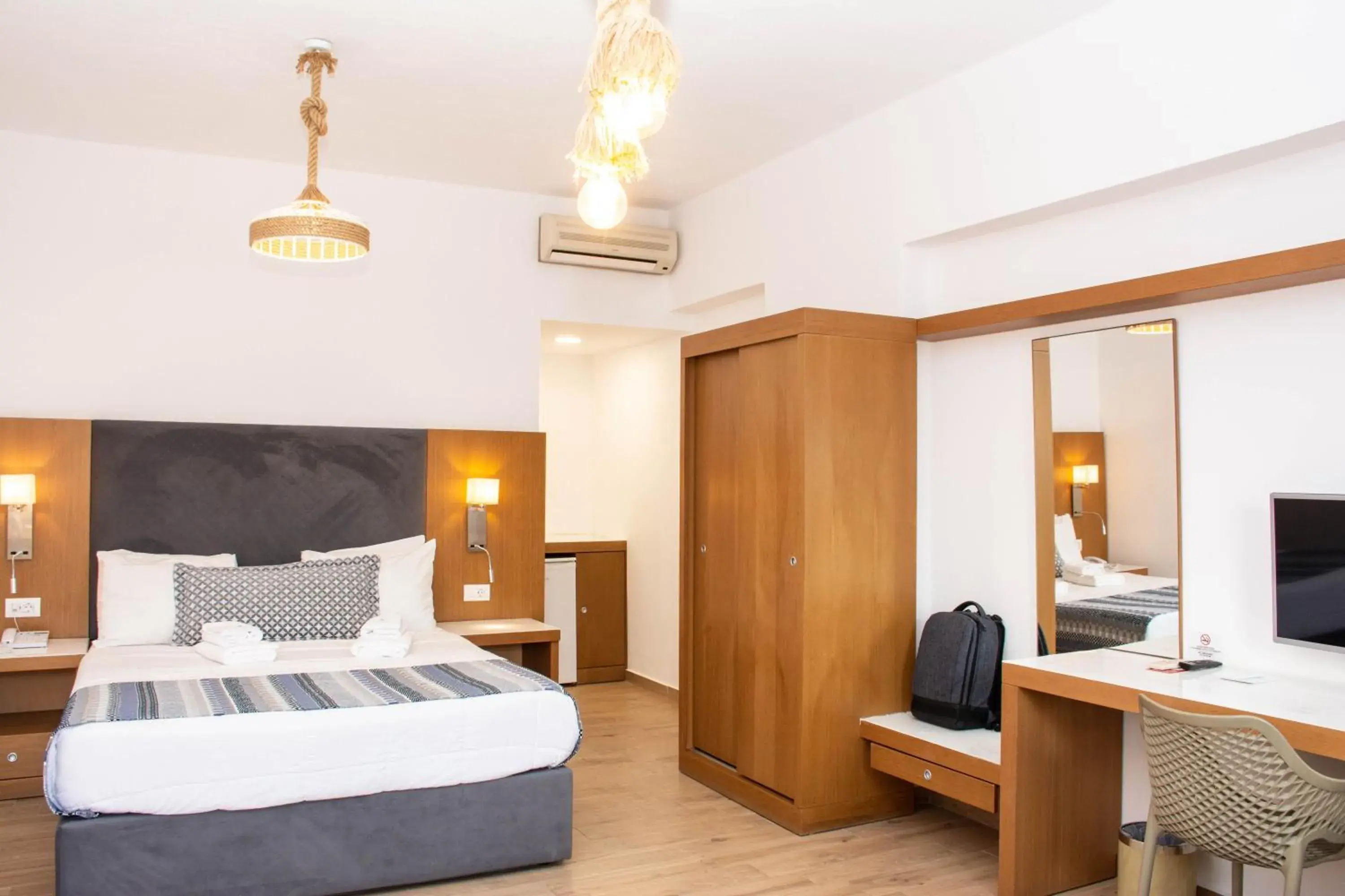 Bedroom, Bed in Yianna Caravel Suites "by Checkin" adults only Bedroom, Bed in Yianna Caravel Suites "by Checkin" adults only