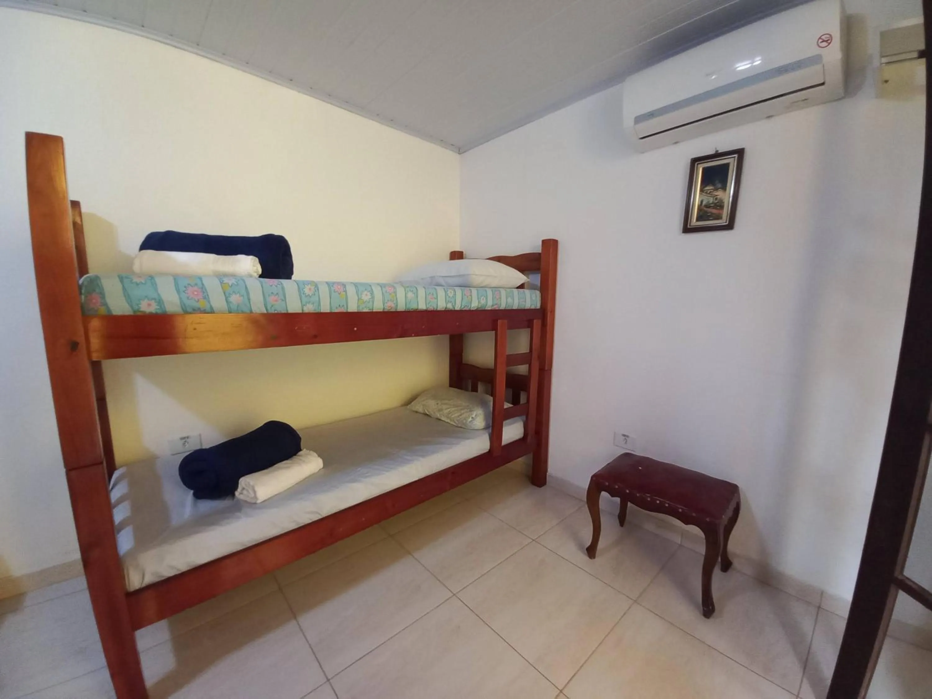 Bed in Suítes Cantinho do Sossego Ubatuba