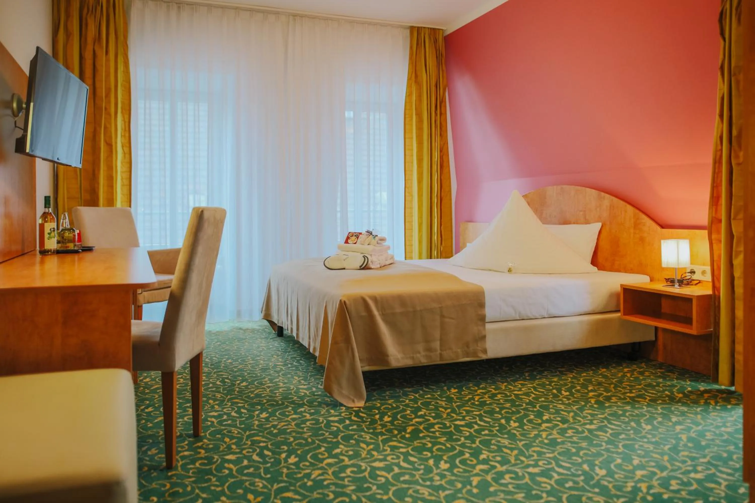 Photo of the whole room, Bed in Kulturhotel Fürst Pückler Park