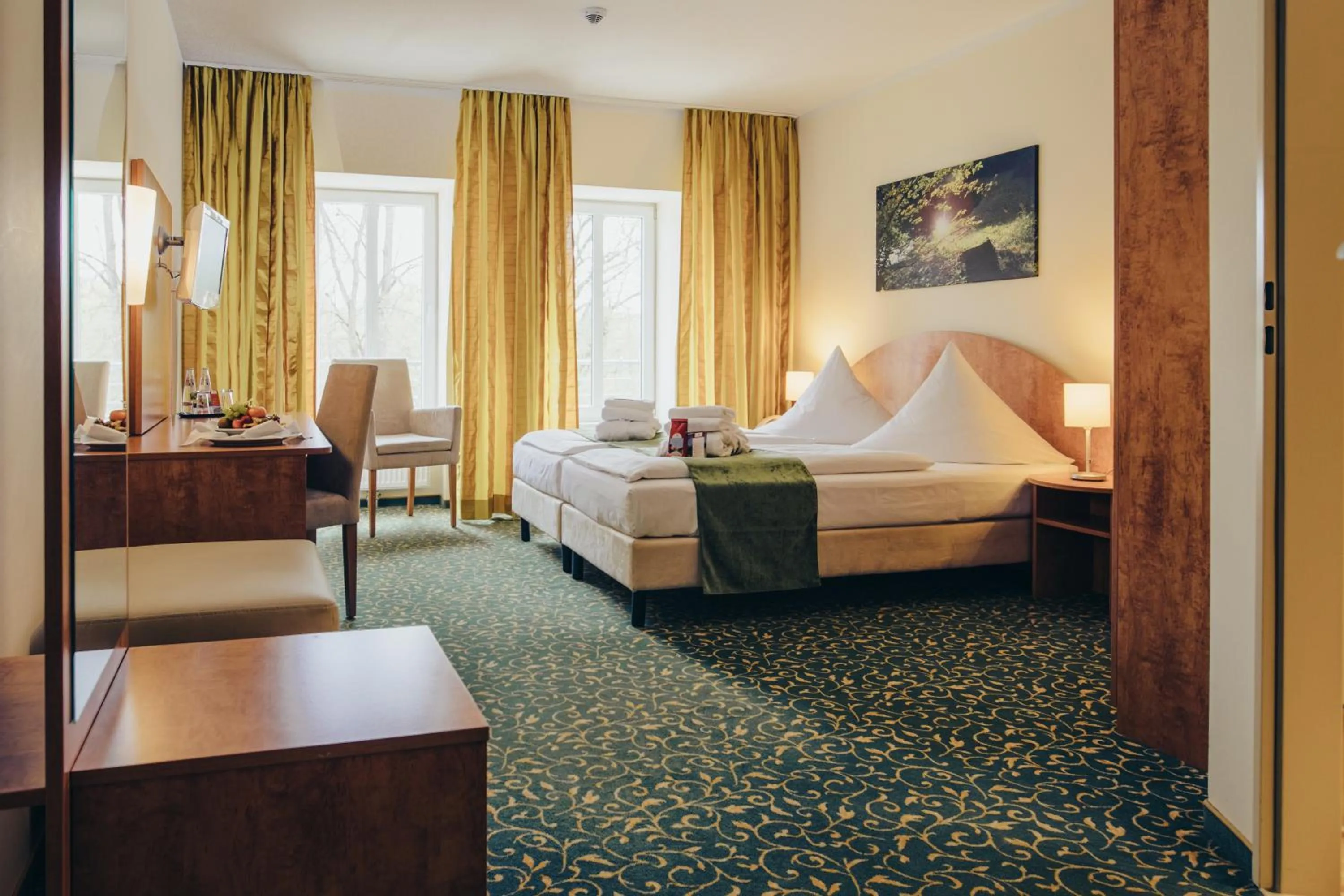 Photo of the whole room, Bed in Kulturhotel Fürst Pückler Park