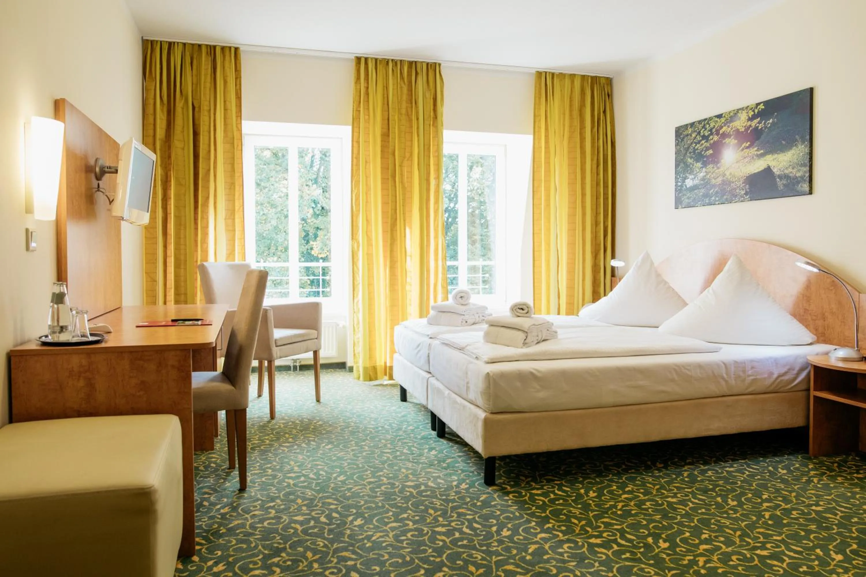 Photo of the whole room, Bed in Kulturhotel Fürst Pückler Park