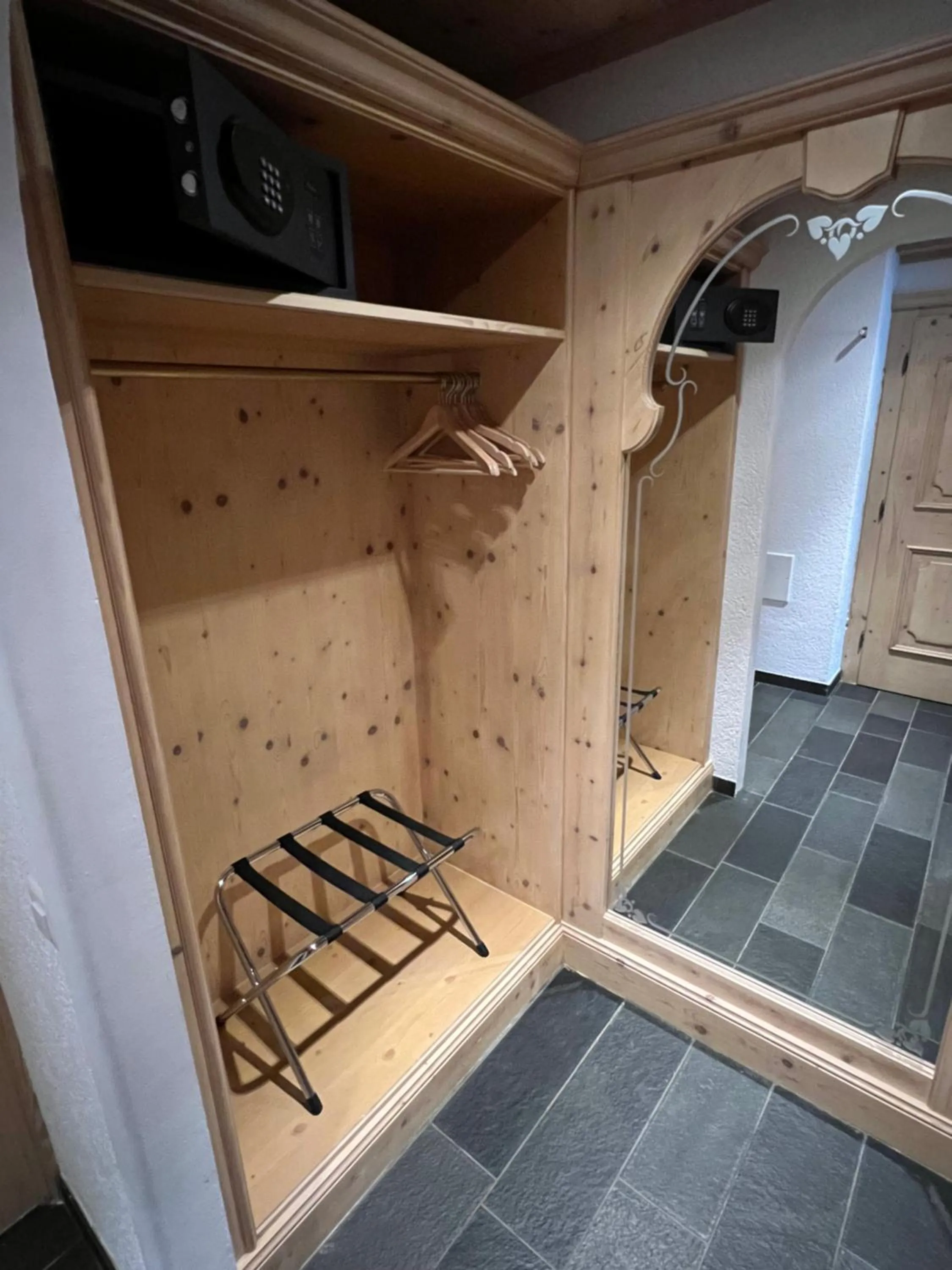 wardrobe in SPANNORT family home with common kitchen and self check-in