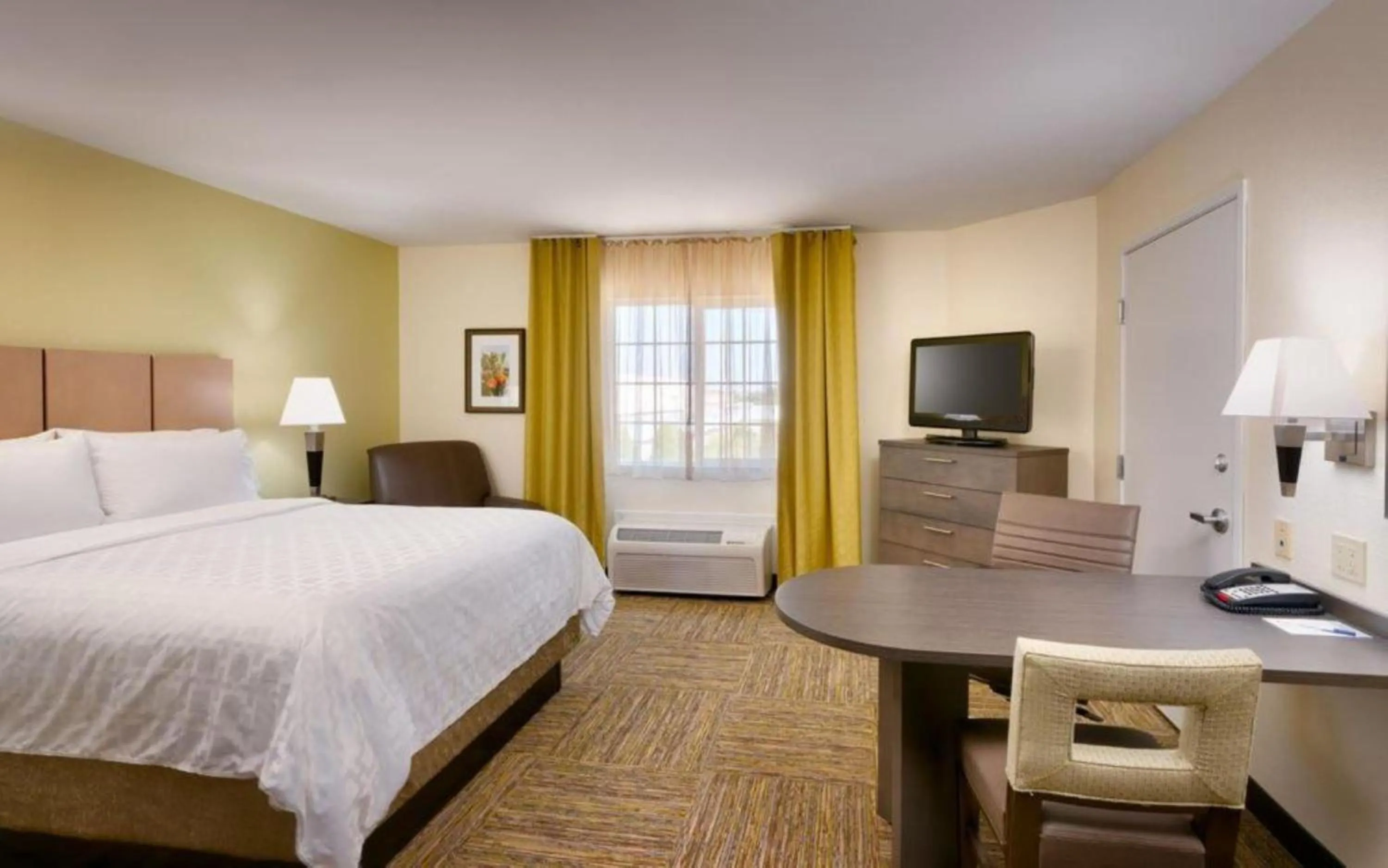 Bed in Candlewood Suites Plano East by IHG
