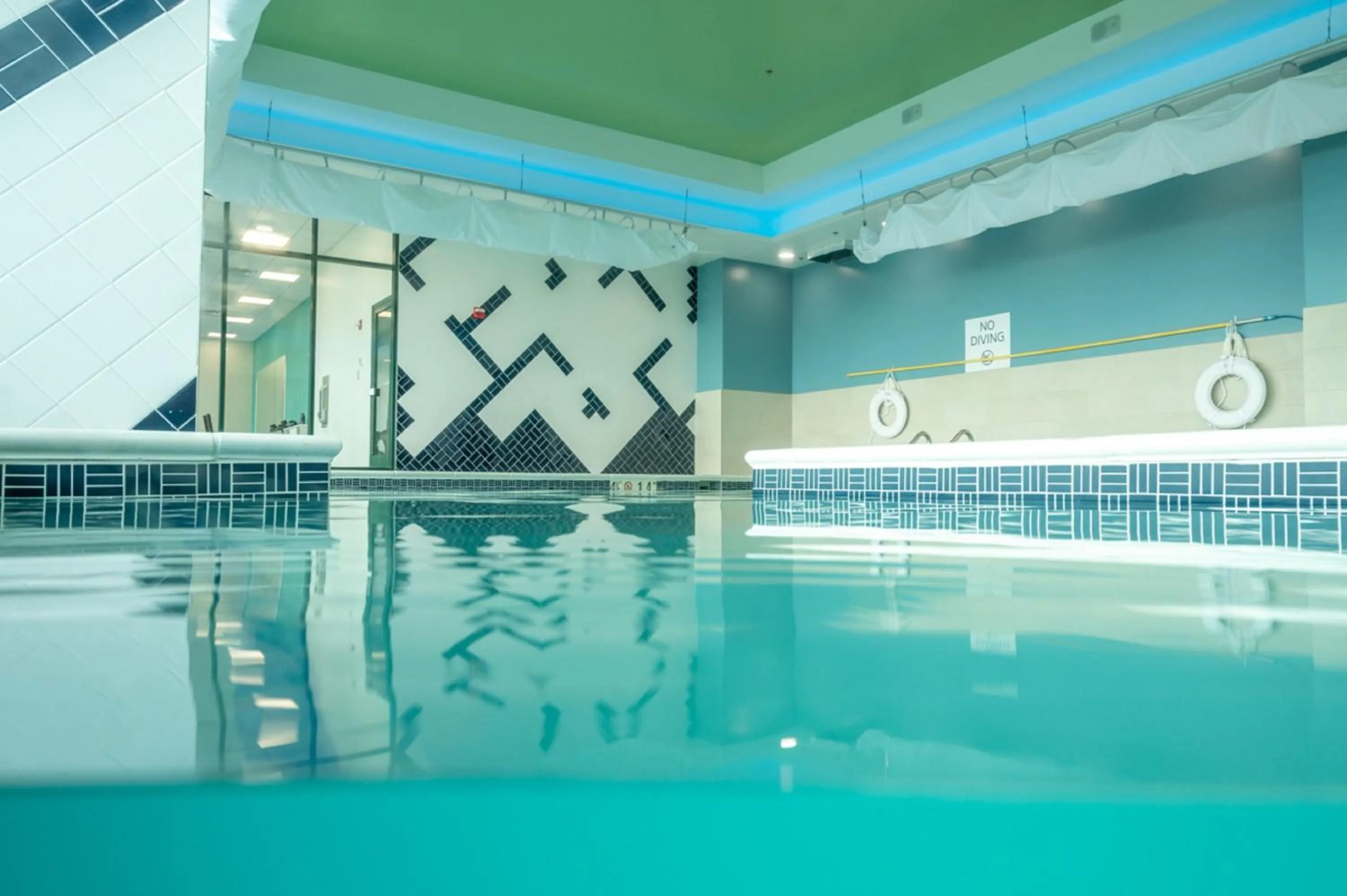 Swimming pool in Holiday Inn Express & Suites VA Beach Oceanfront by IHG