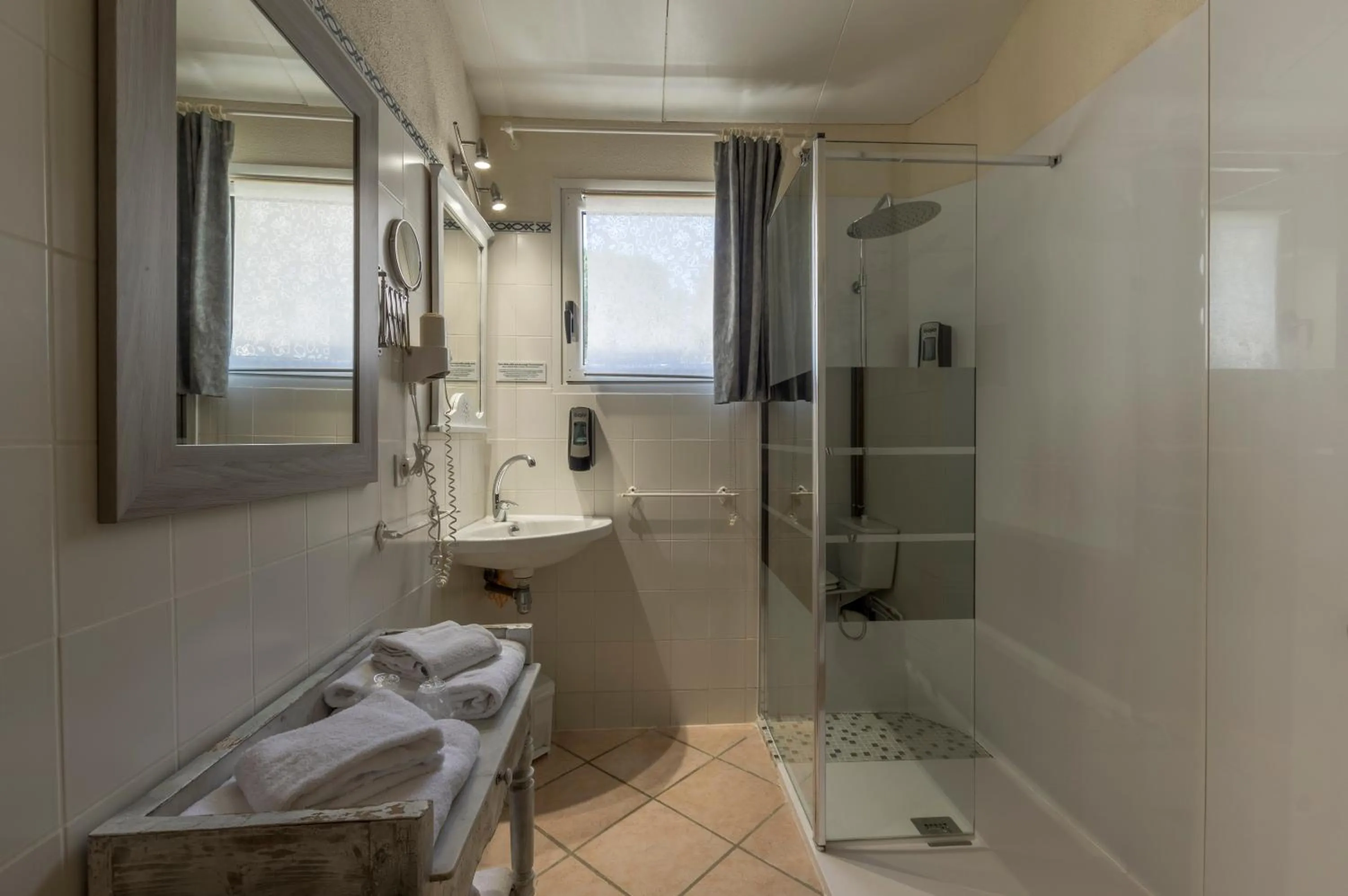 Bathroom in Logis Hotel Le Vieux Moulin