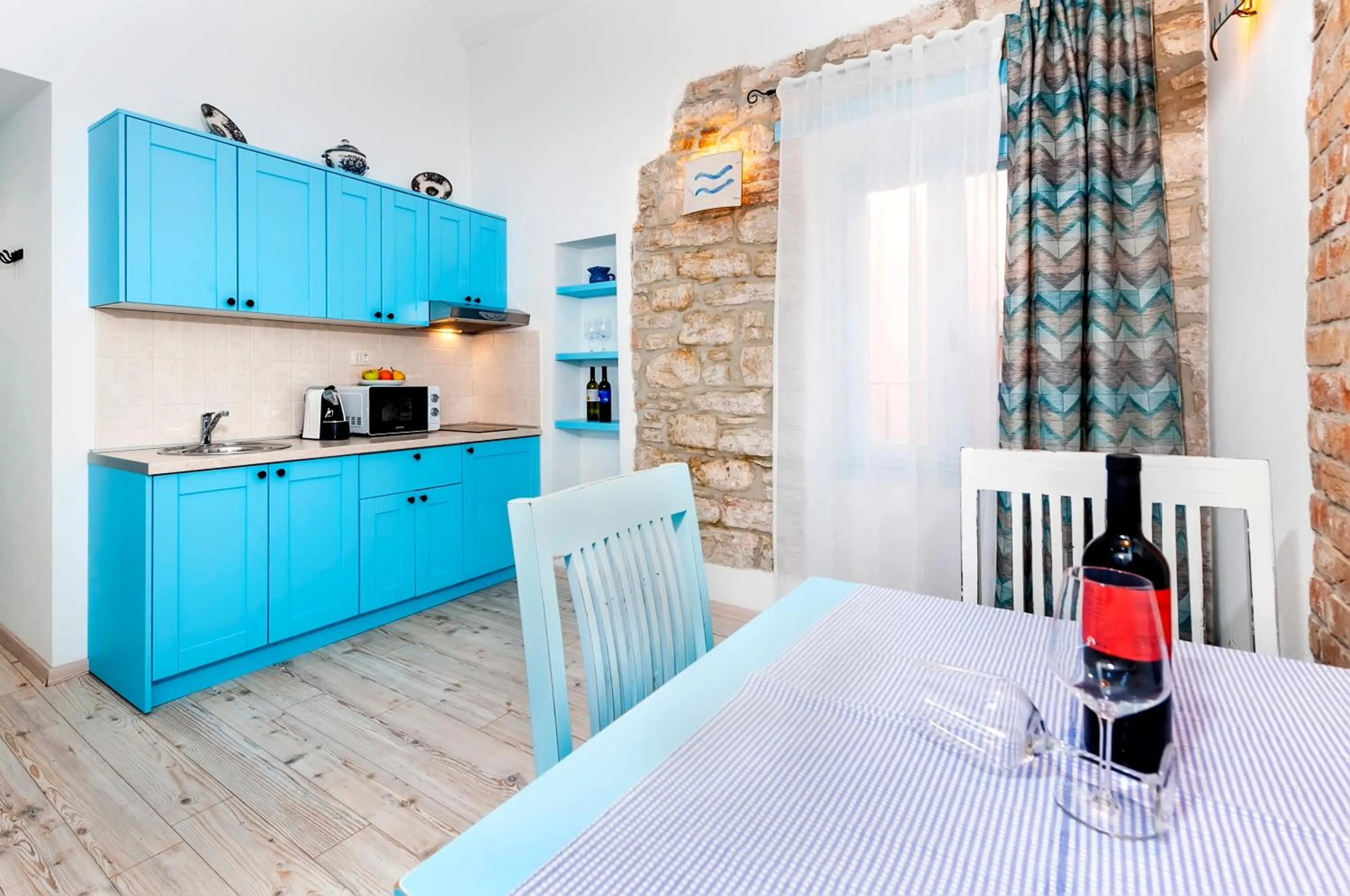 Kitchen or kitchenette in Apartments & Rooms La casa Barbaro