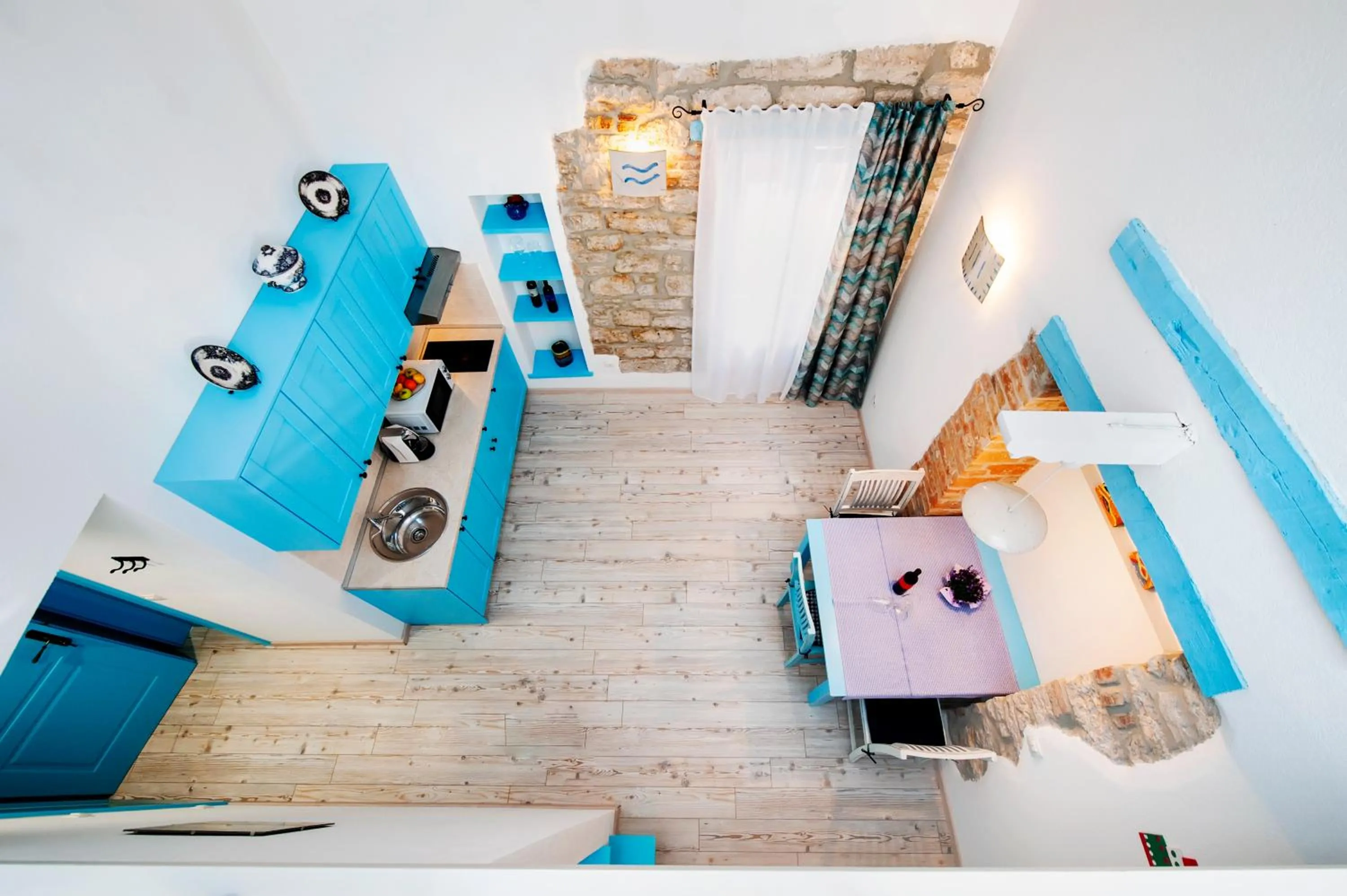 Kitchen or kitchenette, Bed in Apartments & Rooms La casa Barbaro