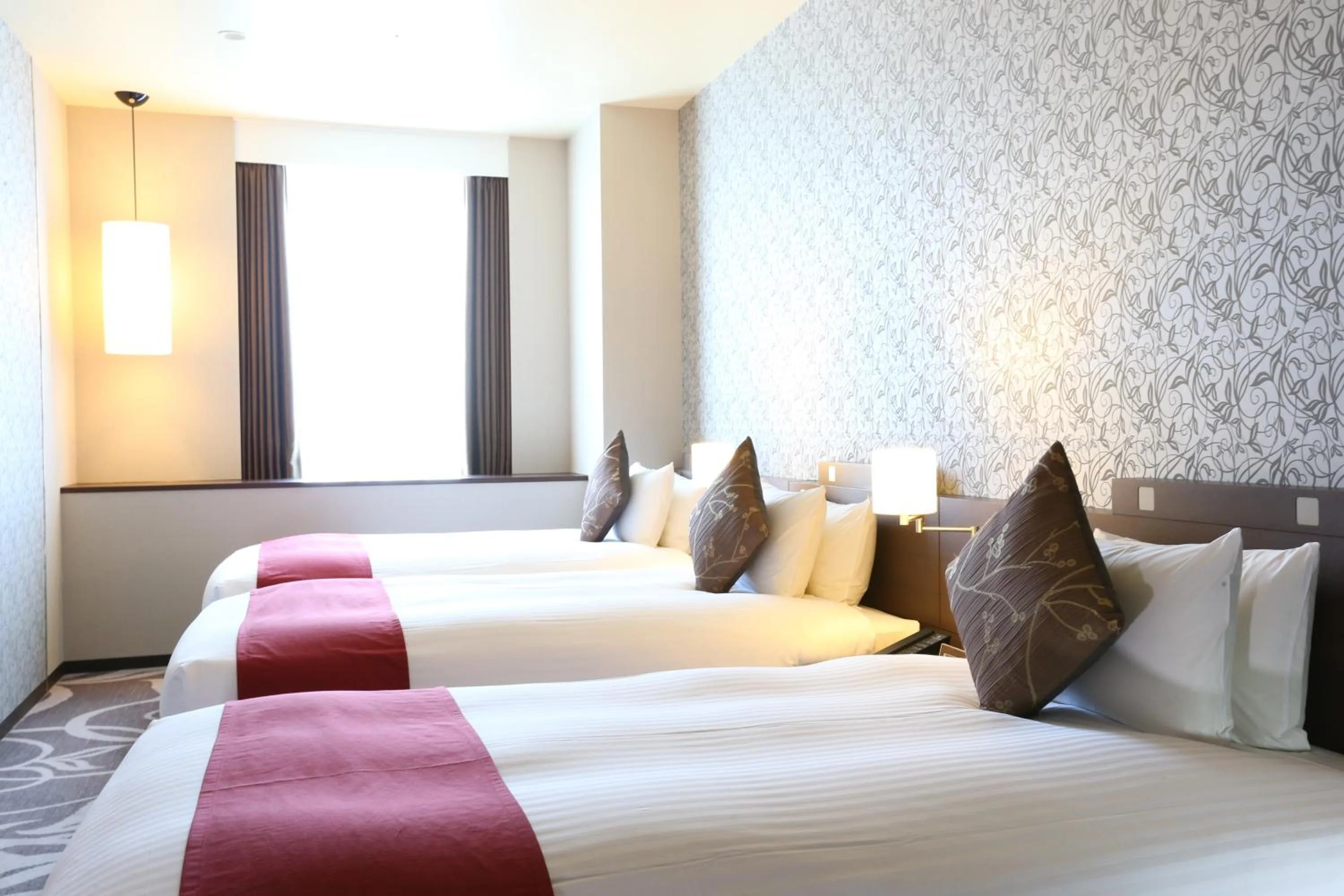 Bed in Hotel La Raison Osaka