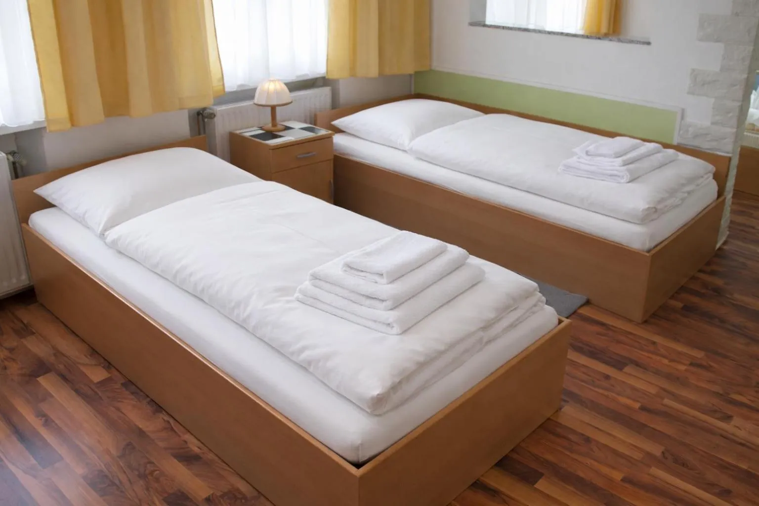 Photo of the whole room, Bed in Pension Central Nuernberg-Fuerth